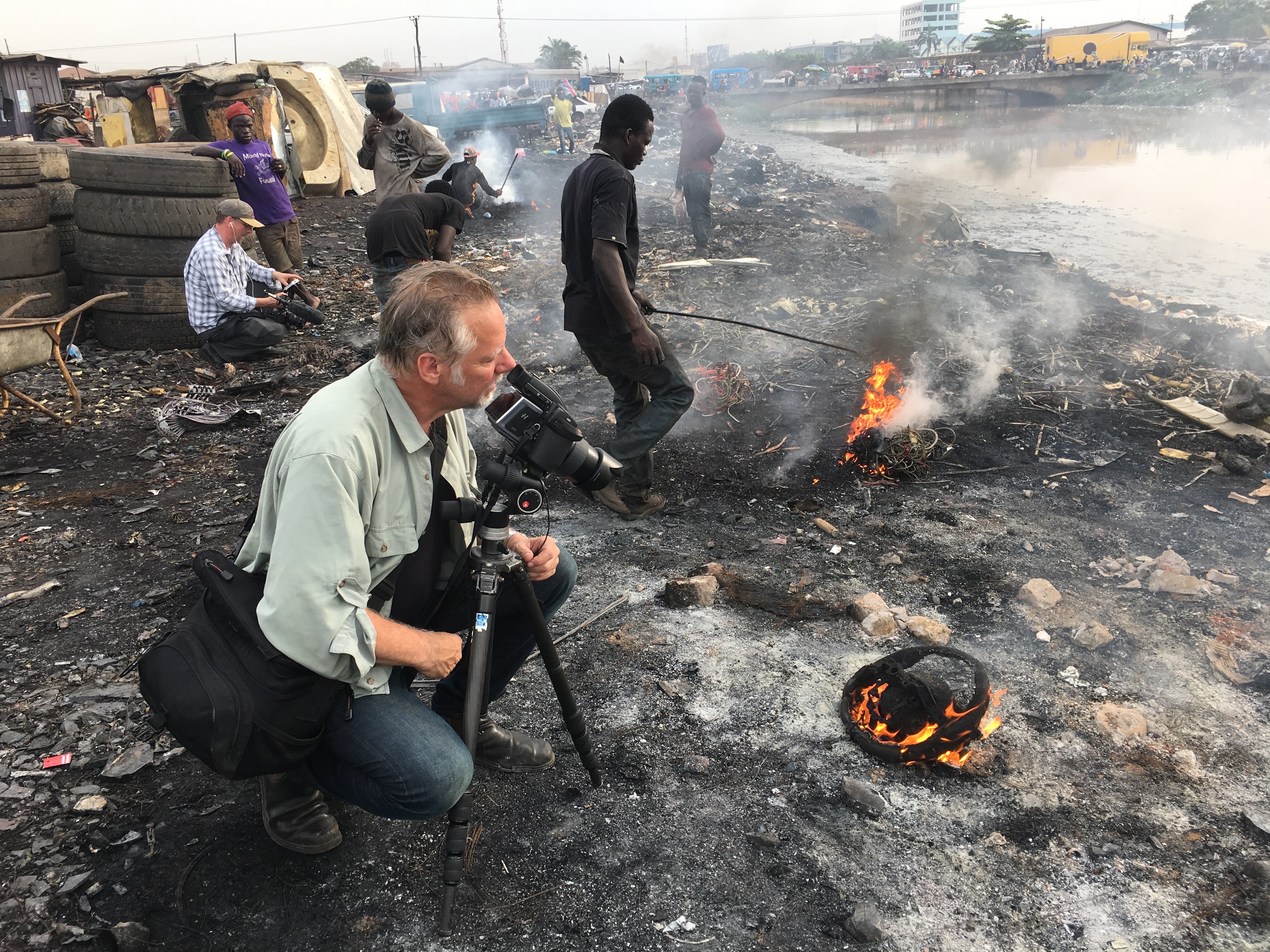 Burtynsky with Jim Panou in Agbogbloshie Recycling Yard, Accra, Ghana, 2017