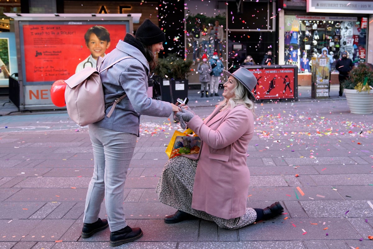 Watch as New York’s Times Square hosts weddings and proposals for Valentines Day