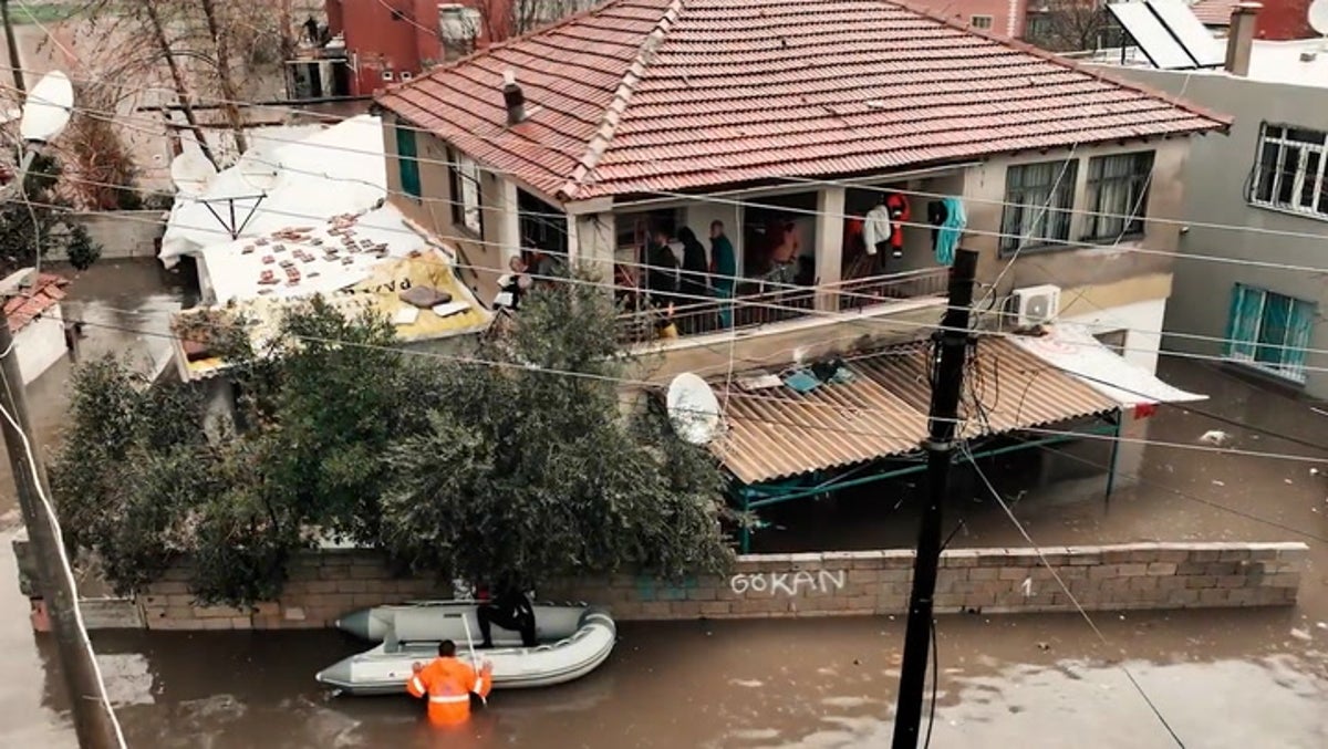 Trapped residents rescued by dinghies as raging floods wash away roads in Turkey