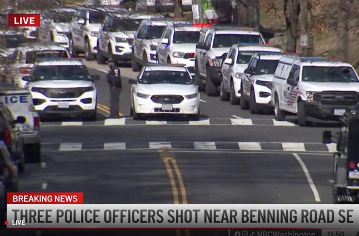 Three police officers shot as gunman remains barricaded in Washington DC home