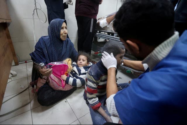 <p>Palestinian children wounded in an Israeli strike receive treatment at Nasser hospital in Khan Younis</p>