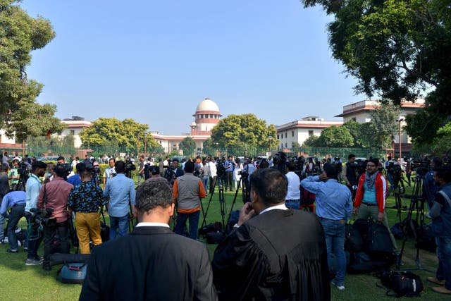 <p>File: A crowd gathers outside India’s Supreme Court</p>
