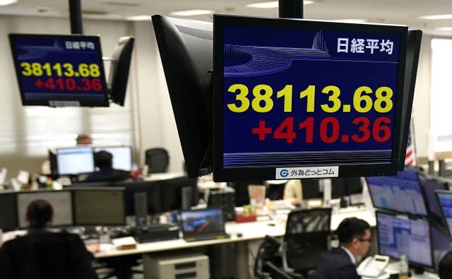 <p>Japan Financial Monitors show Nikkei stock index at a foreign exchange trader’s company in Tokyo, Thursday</p>