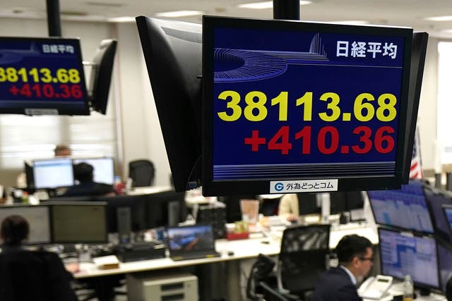 <p>Japan Financial Monitors show Nikkei stock index at a foreign exchange trader’s company in Tokyo, Thursday</p>