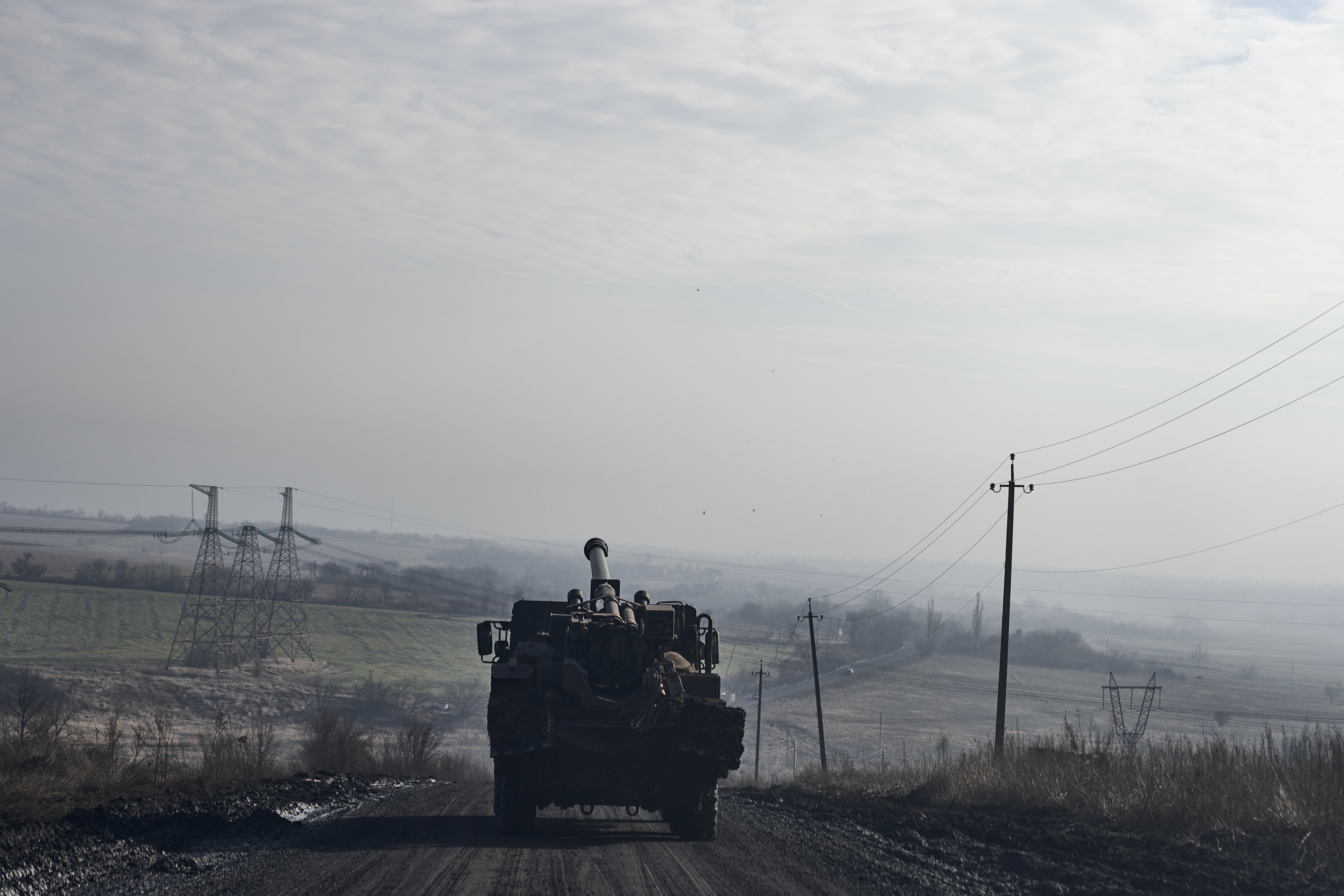 Artillery system moves to firing positions on the road to the city, on the outskirts of Avdiivka