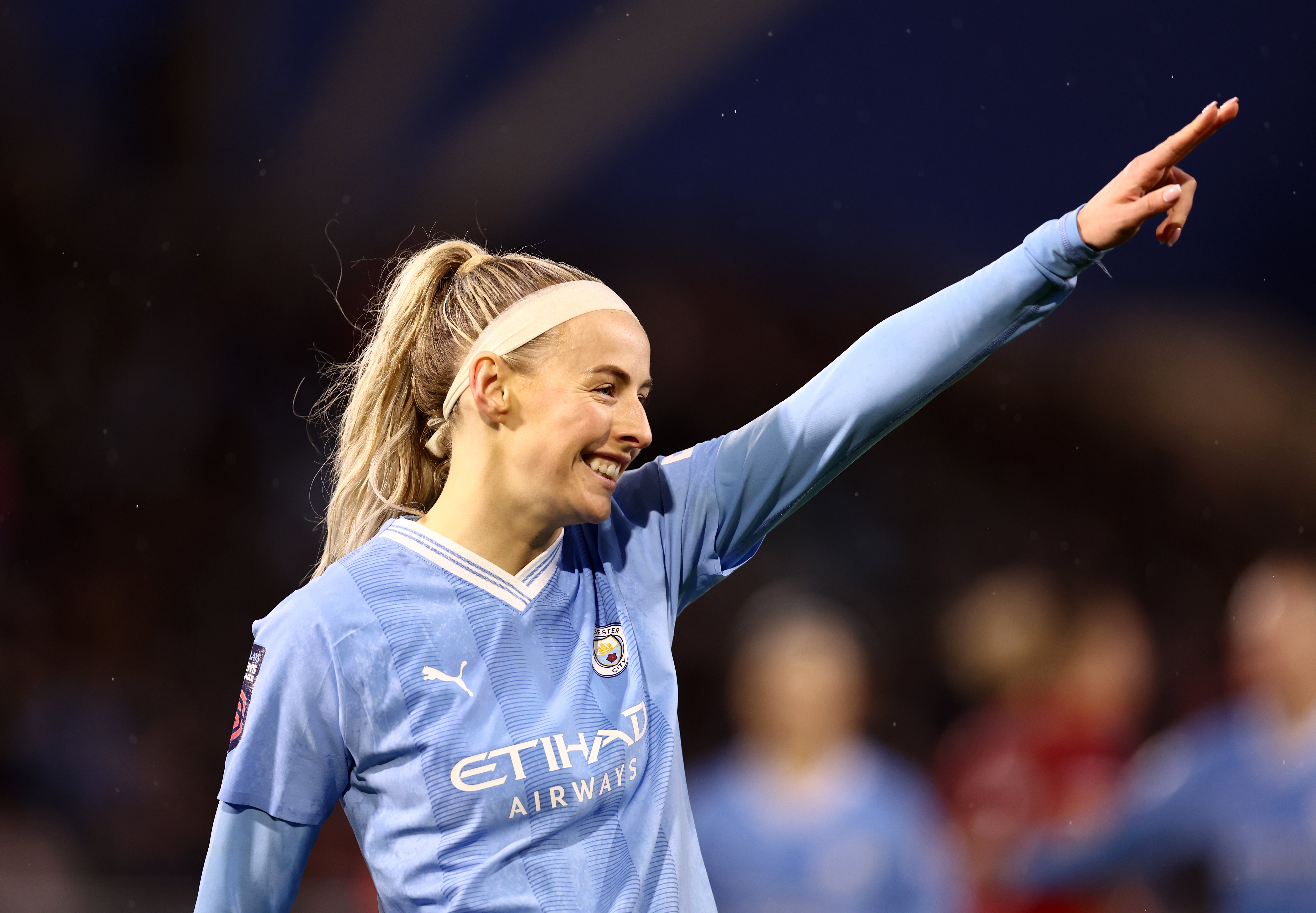 Kelly celebrates scoring for Man City against Liverpool