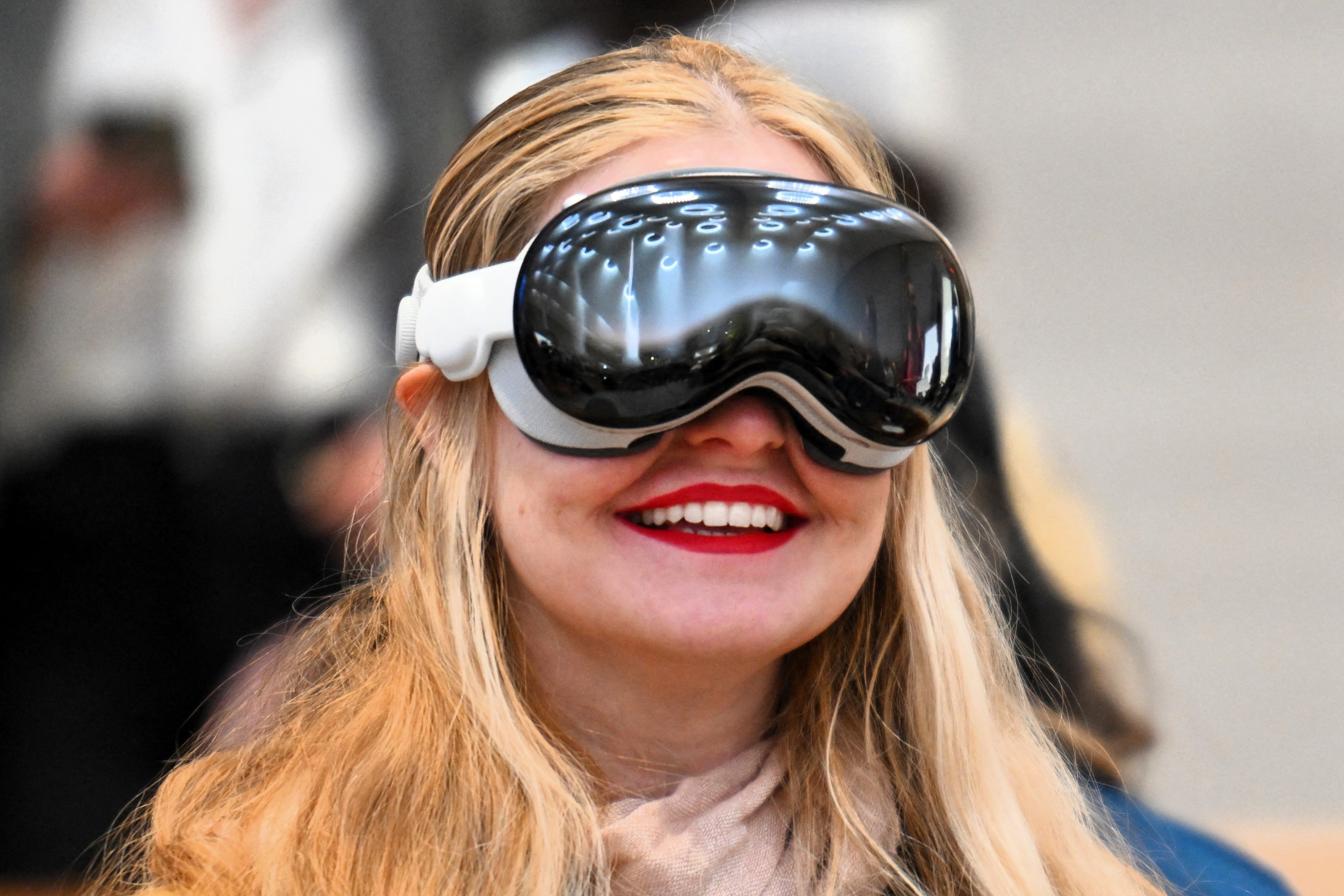 <p>A customer tries on the Apple Vision Pro headset during the product release at the Apple Store in New York City on 2 February, 2024</p>