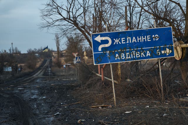 <p>A street sign seen on the road to the city on the outskirts of Avdiivka </p>