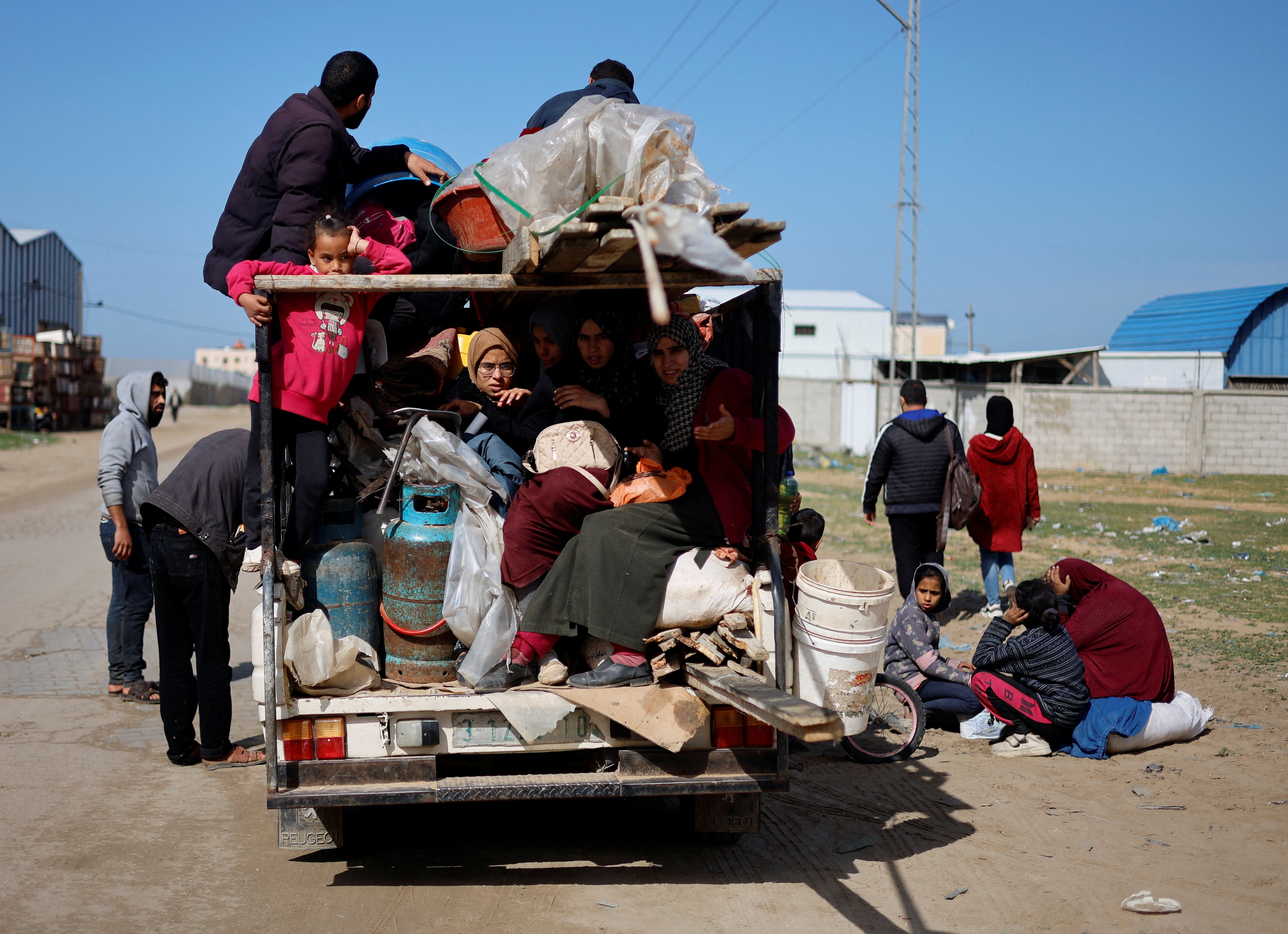 Palestinian arrive in Rafah after they were evacuated from Nasser hospital in Khan Younis due to the Israeli ground operation, amid the ongoing conflict between Israel and Hamas, in the southern Gaza Strip