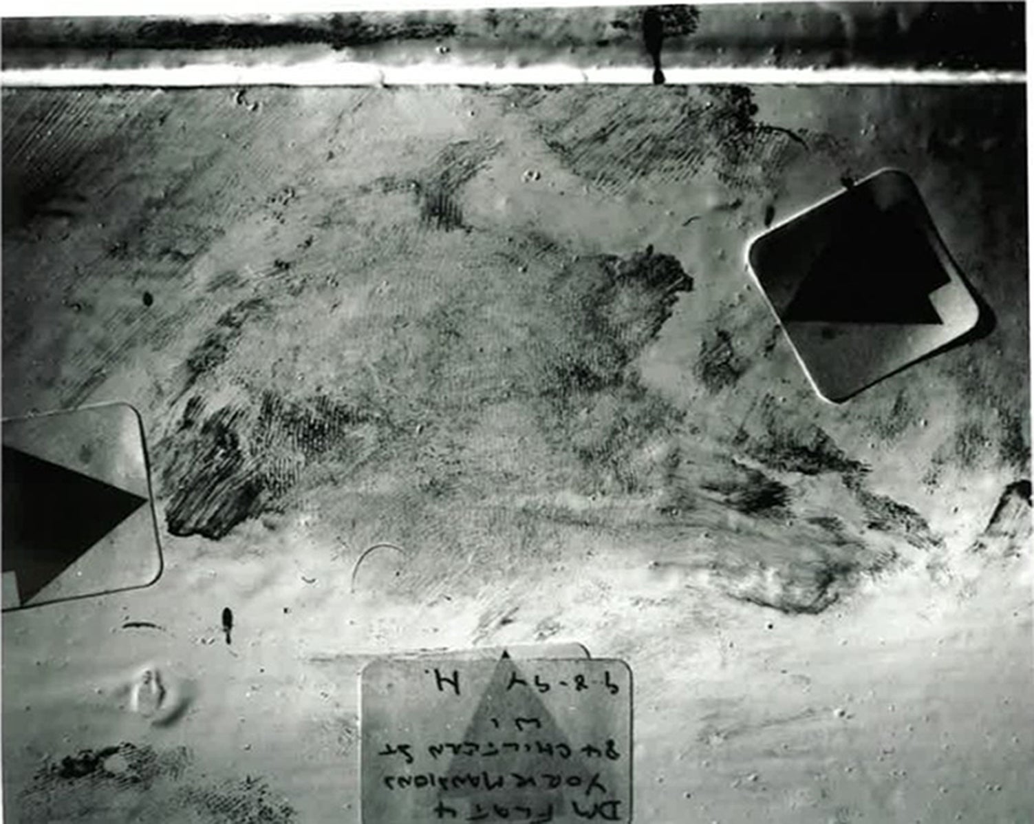 A bloody footprint on a skirting board