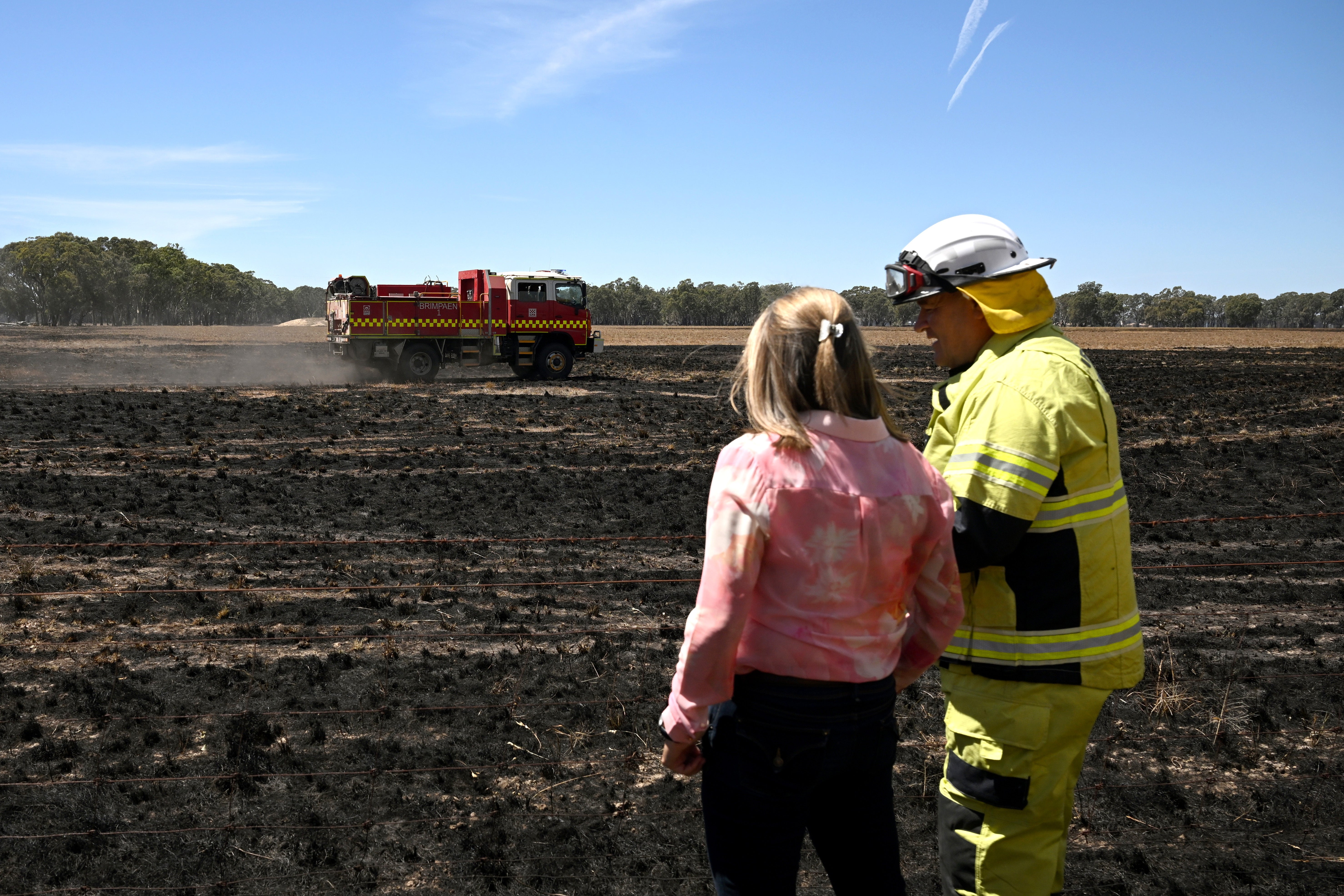 Victorian Premier Jacinta Allan (L) and Fire Rescue Victoria incident controller Mark Gunning (R) tour a fire-damaged property at Dadswell Bridge, Victoria, Australia, 15 February 2024