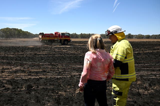 <p>Victorian Premier Jacinta Allan (L) and Fire Rescue Victoria incident controller Mark Gunning (R) tour a fire-damaged property at Dadswell Bridge, Victoria, Australia, 15 February 2024</p>