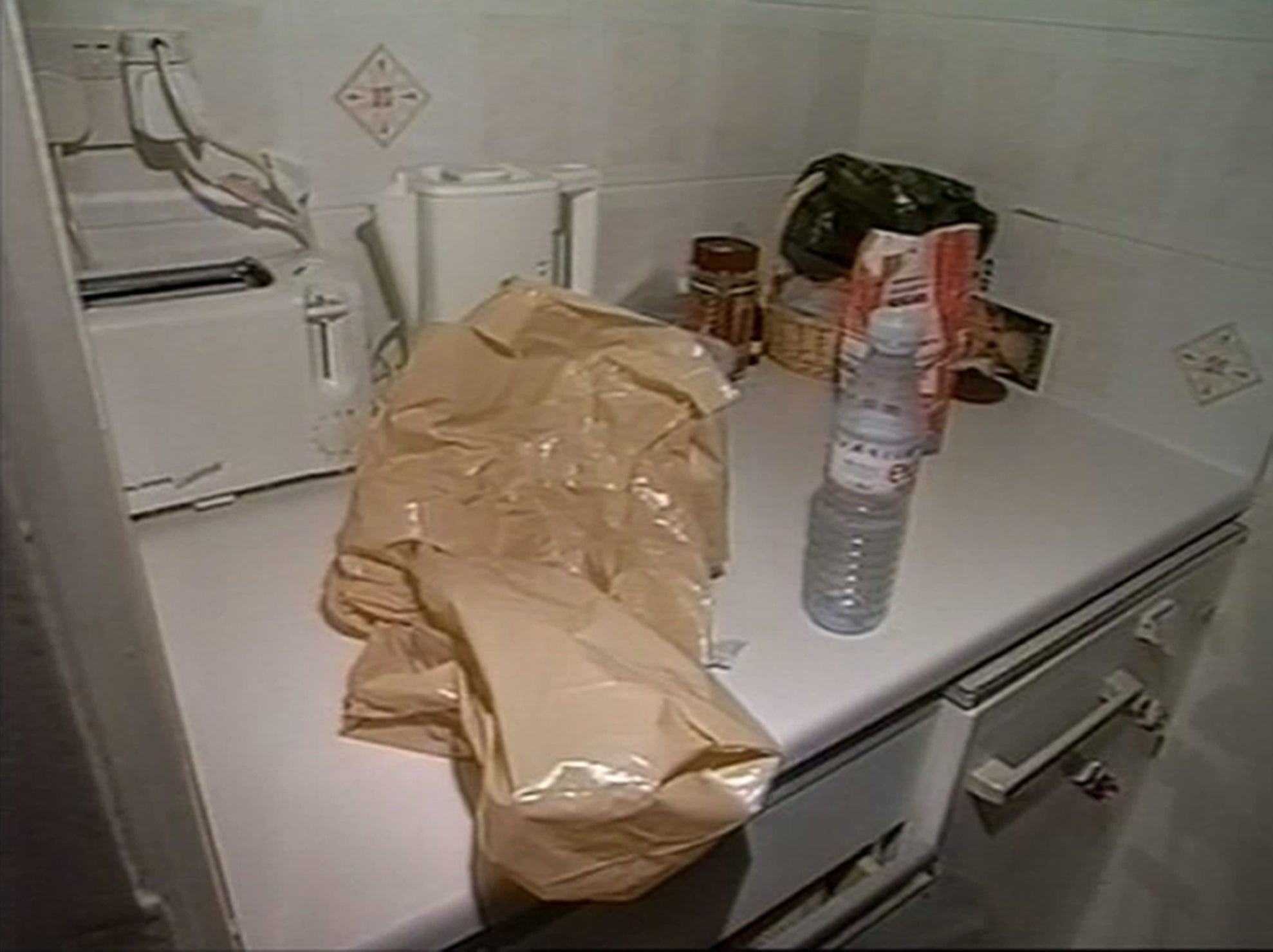 Undated handout photo issued by Metropolitan Police of a brown plastic bag in the kitchen of Marina Koppel