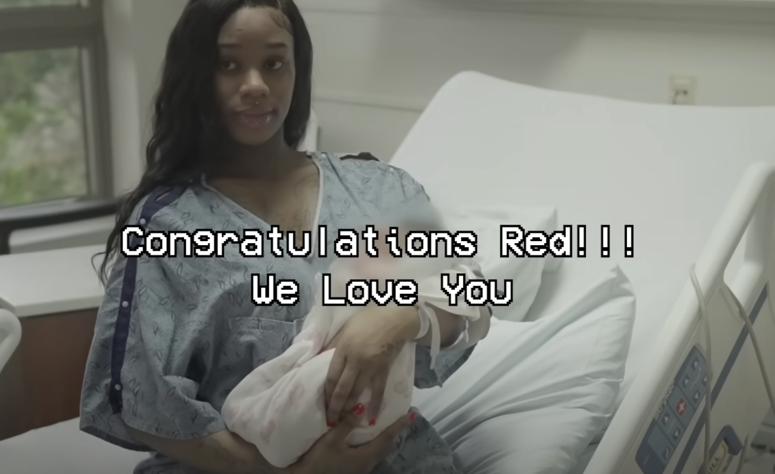 The real footage shows a congratulatory message for Red as she holds her new baby