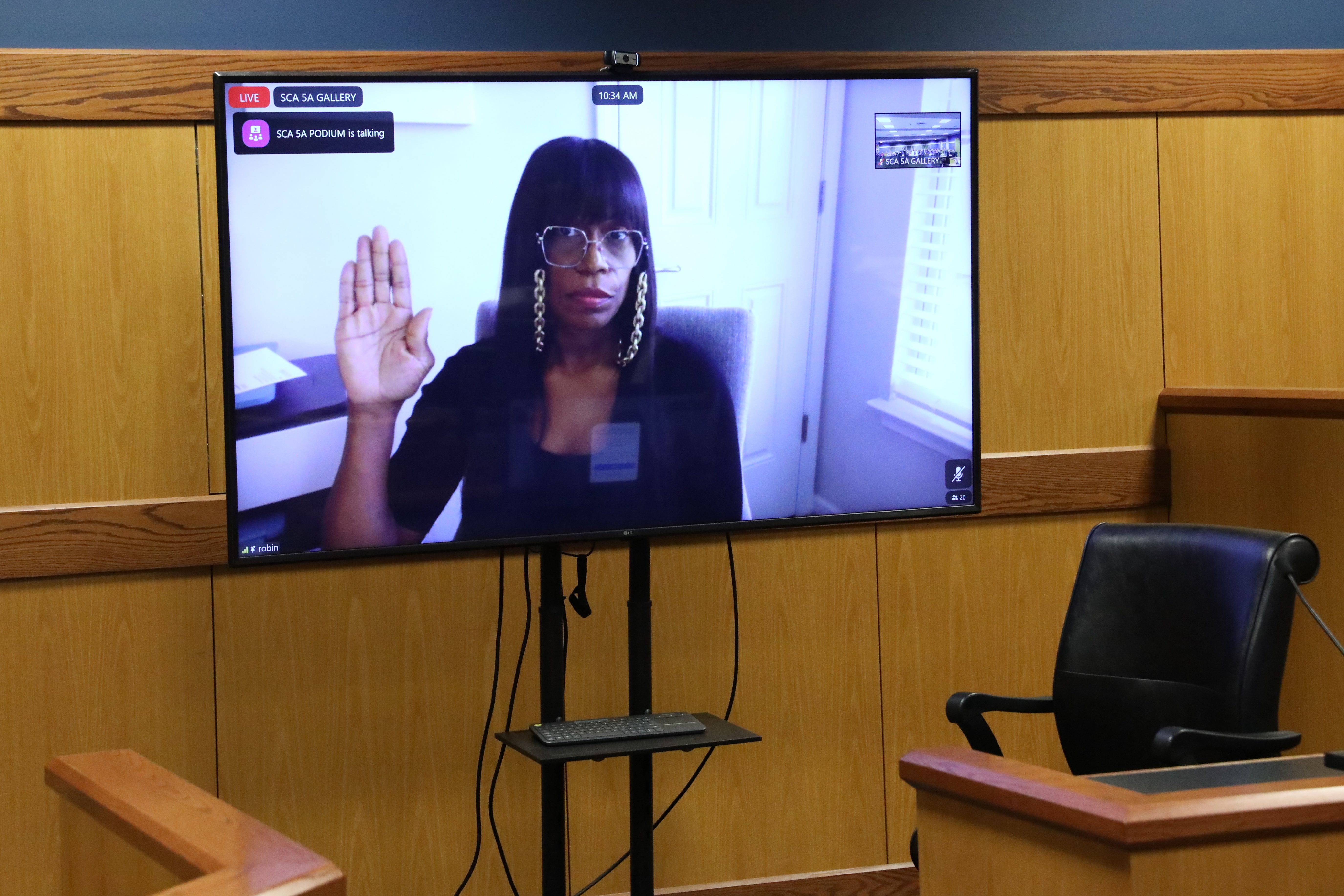 Witness Robin Yeartie appears on a screen as she is sworn in during a hearing in the case of the State of Georgia v Donald Trump