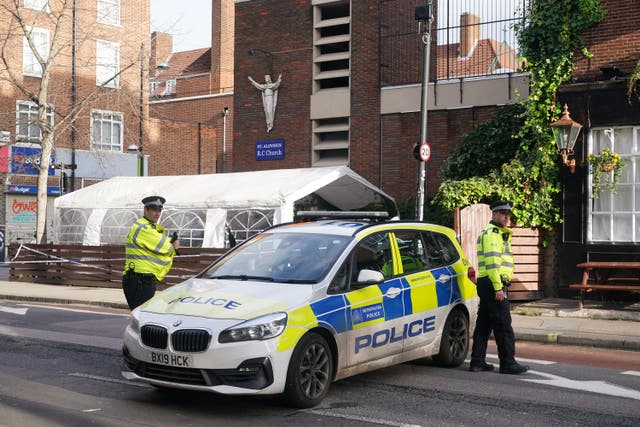 Police at the scene of the shooting (Yui Mok/PA)