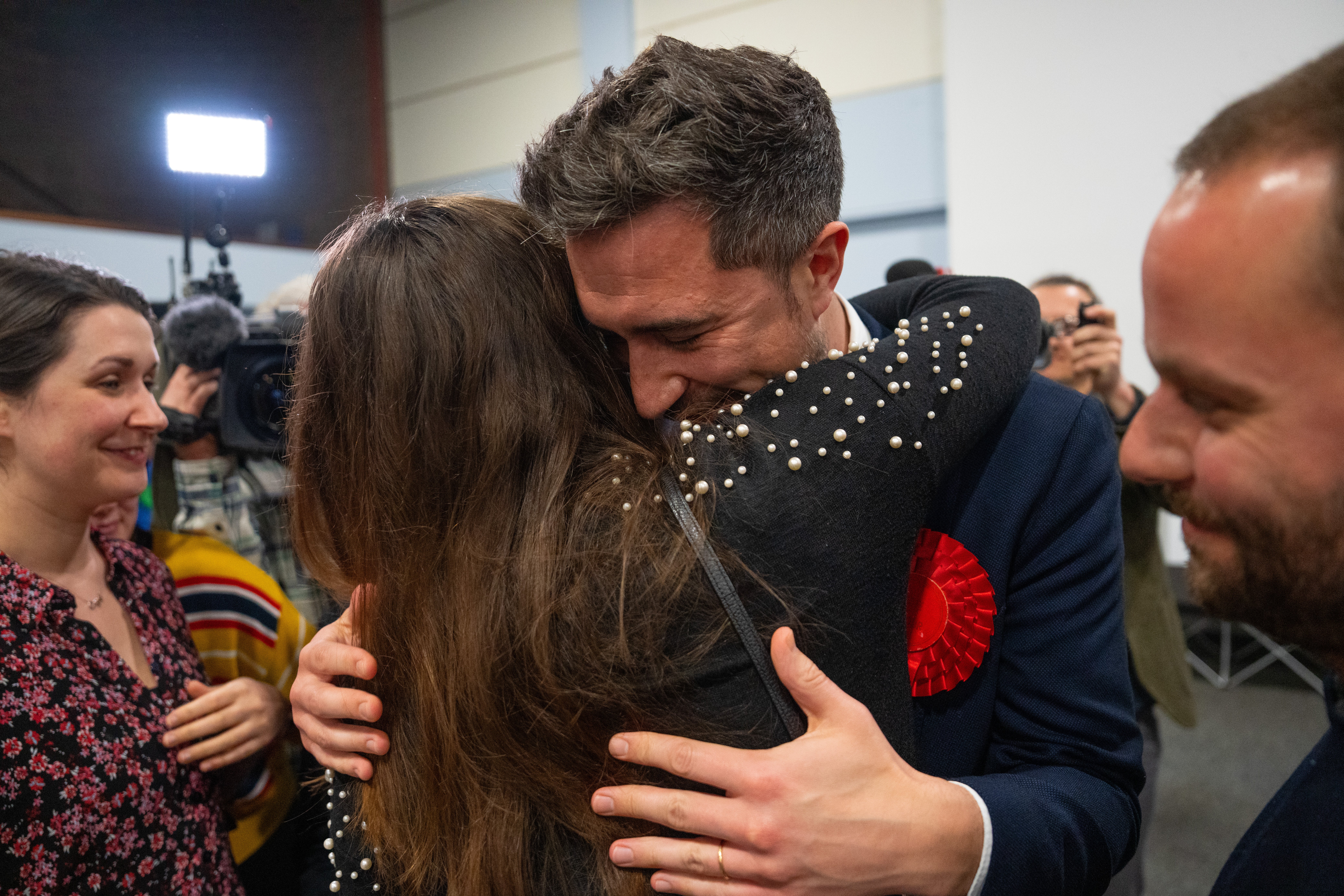 Labour Party candidate, Damien Egan, is hugged after being declared the winner in the Kingswood by-election