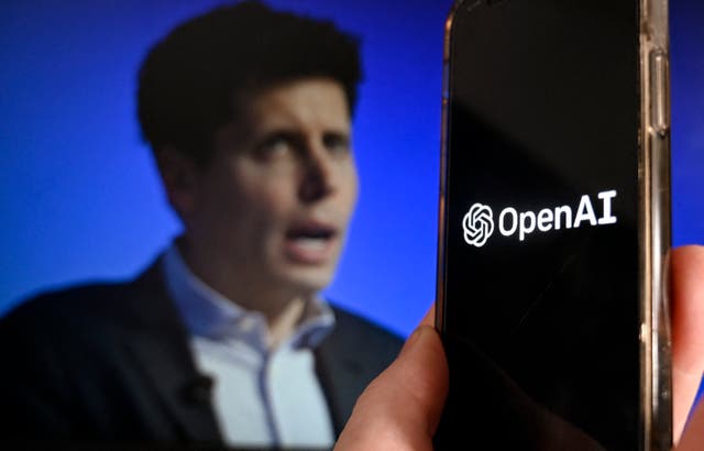 <p>This illustration photo produced in Arlington, Virginia on November 20, 2023, shows a smart phone screen displaying the logo of OpenAI juxtaposed with a screen showing a photo of former OpenAI CEO Sam Altman attending the Asia-Pacific Economic Cooperation (APEC) Leaders’ Week in San Francisco, California, on November 16, 2023</p>