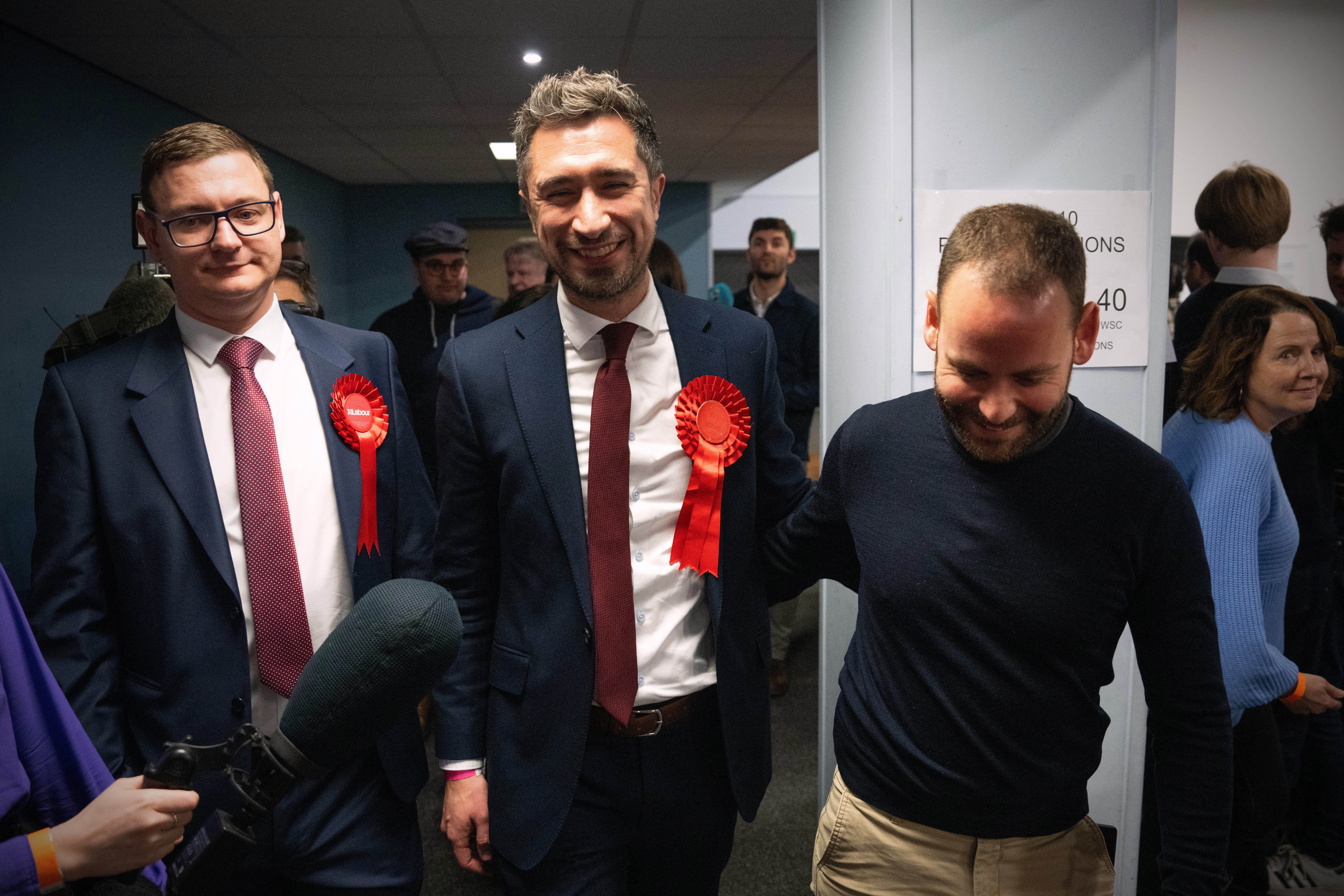 Mr Egan leaves with his husband Yossi Felderbaum (R) after being declared the winner in the Kingswood by-election