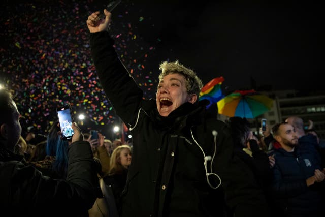 <p>A supporter of the same-sex marriage bill, reacts during a rally at central Syntagma Square, in Athens, Greece</p>