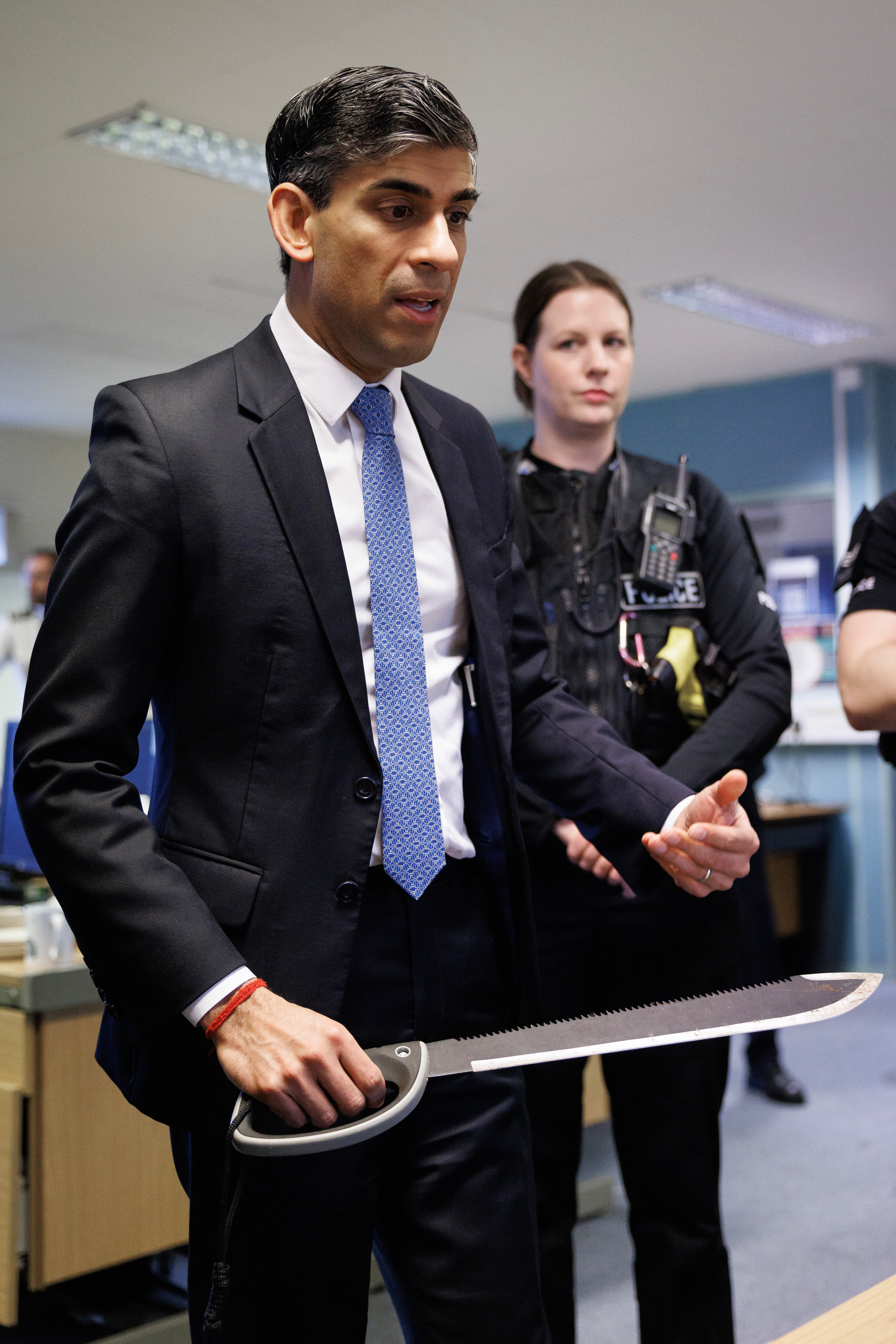 Rishi Sunak with a zombie knife during a recent visit to Harlow Police Station