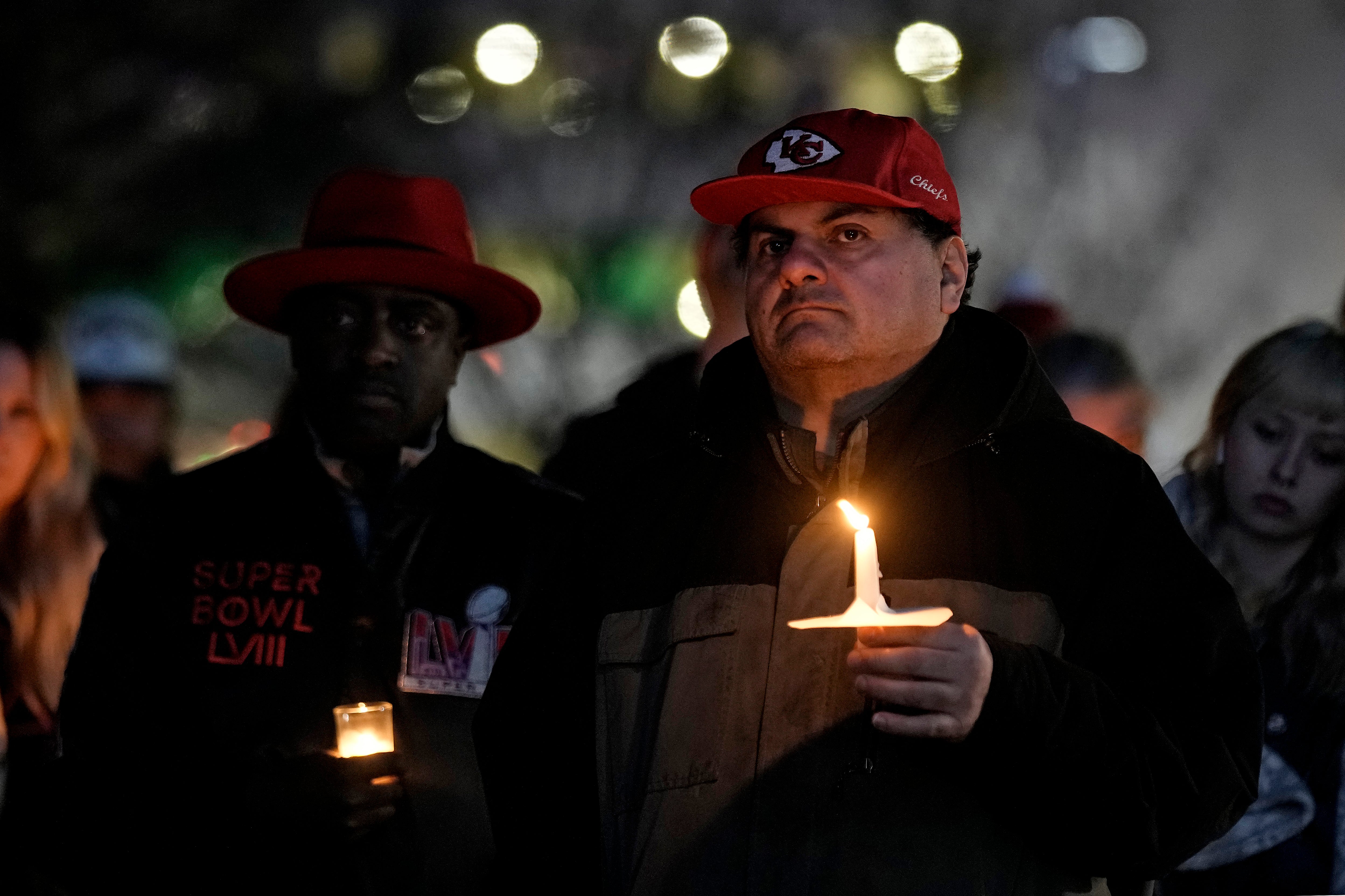A man holds a candle at the Kansas City, Missouri vigil