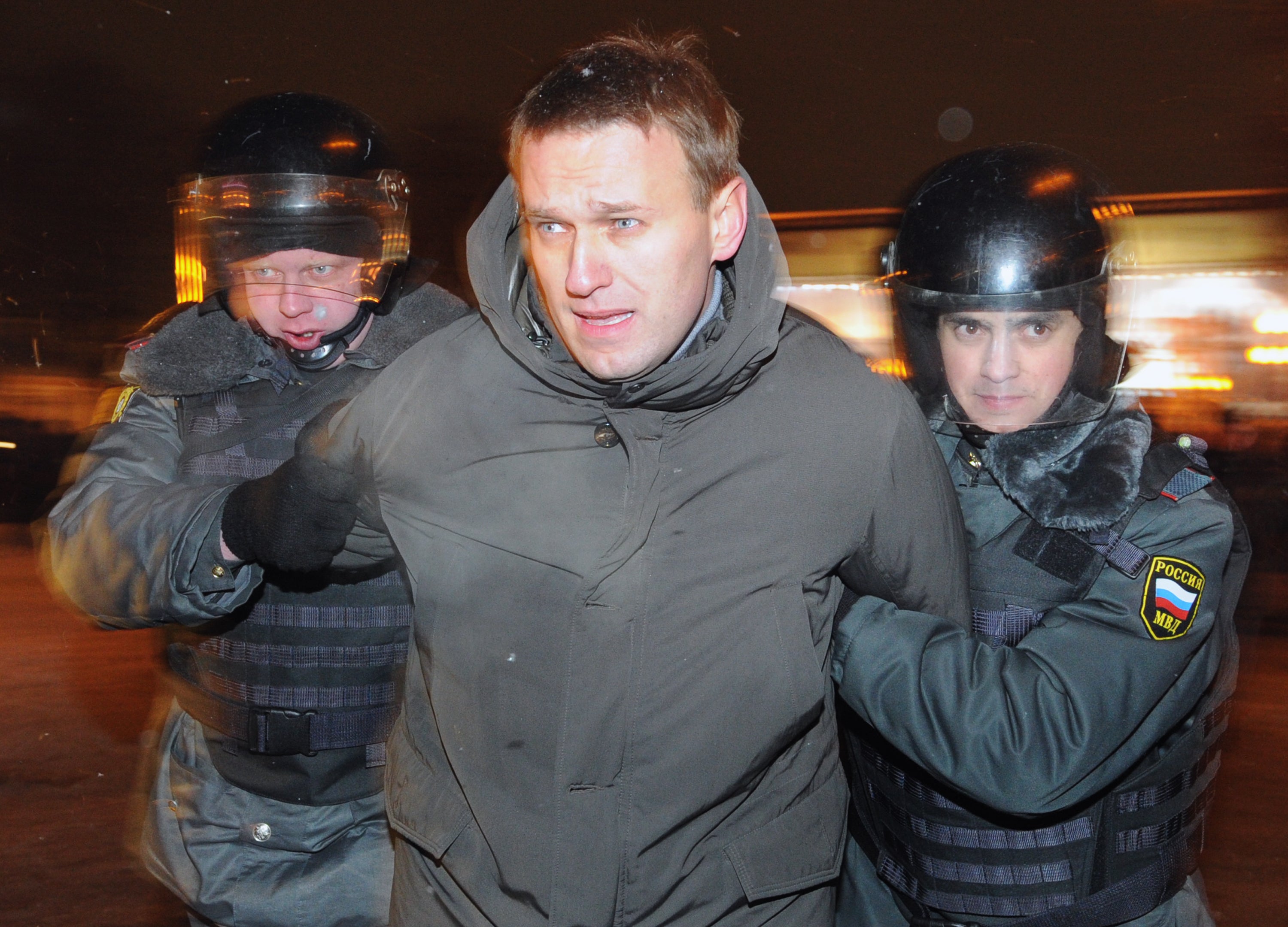 Police officers detain Alexeo Navalny, at Moscow's Pushkinskaya Square, on March 5, 2012