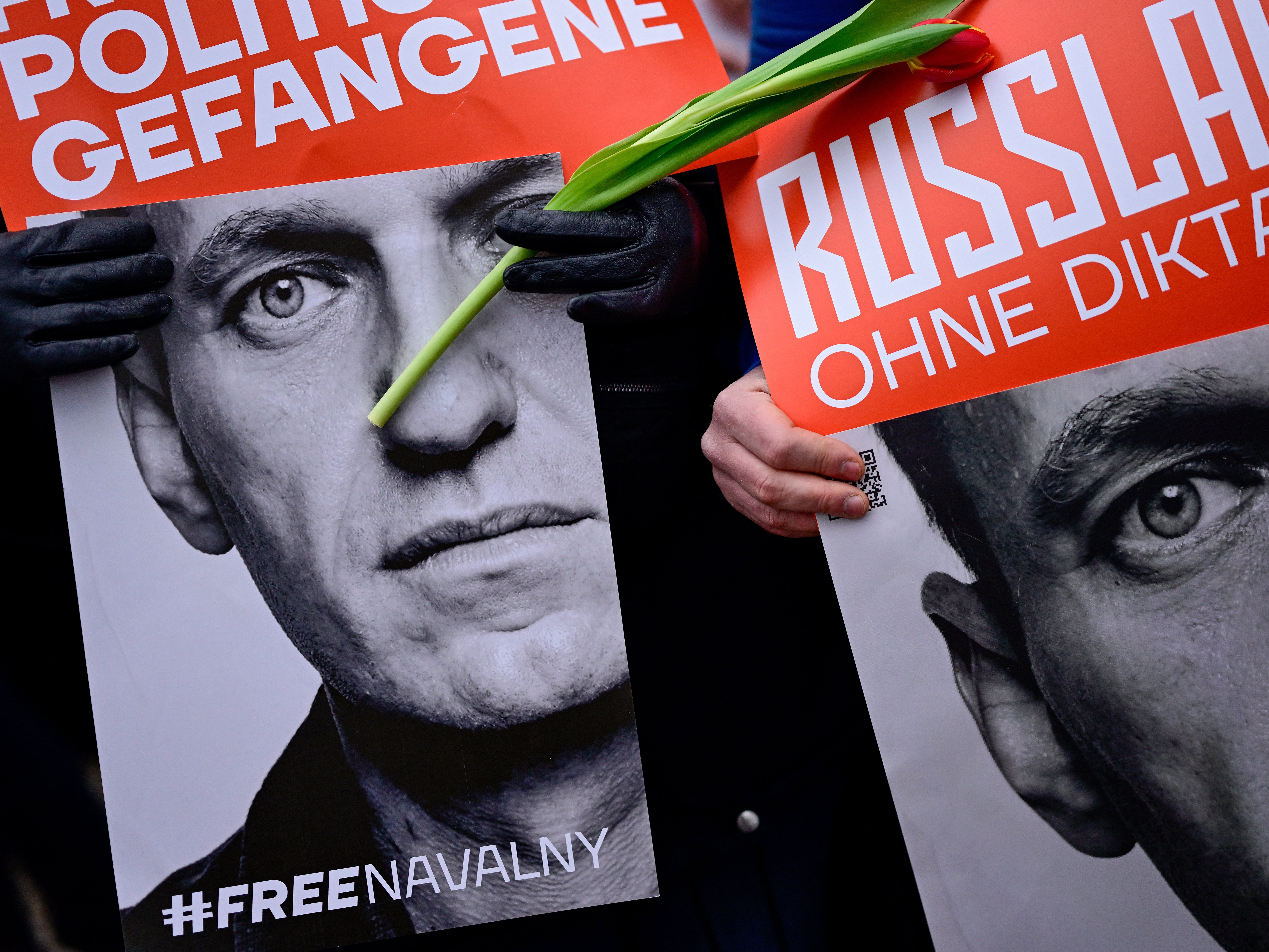 Protesters outside the Russian embassy in Berlin following the announcement of Navalny’s death