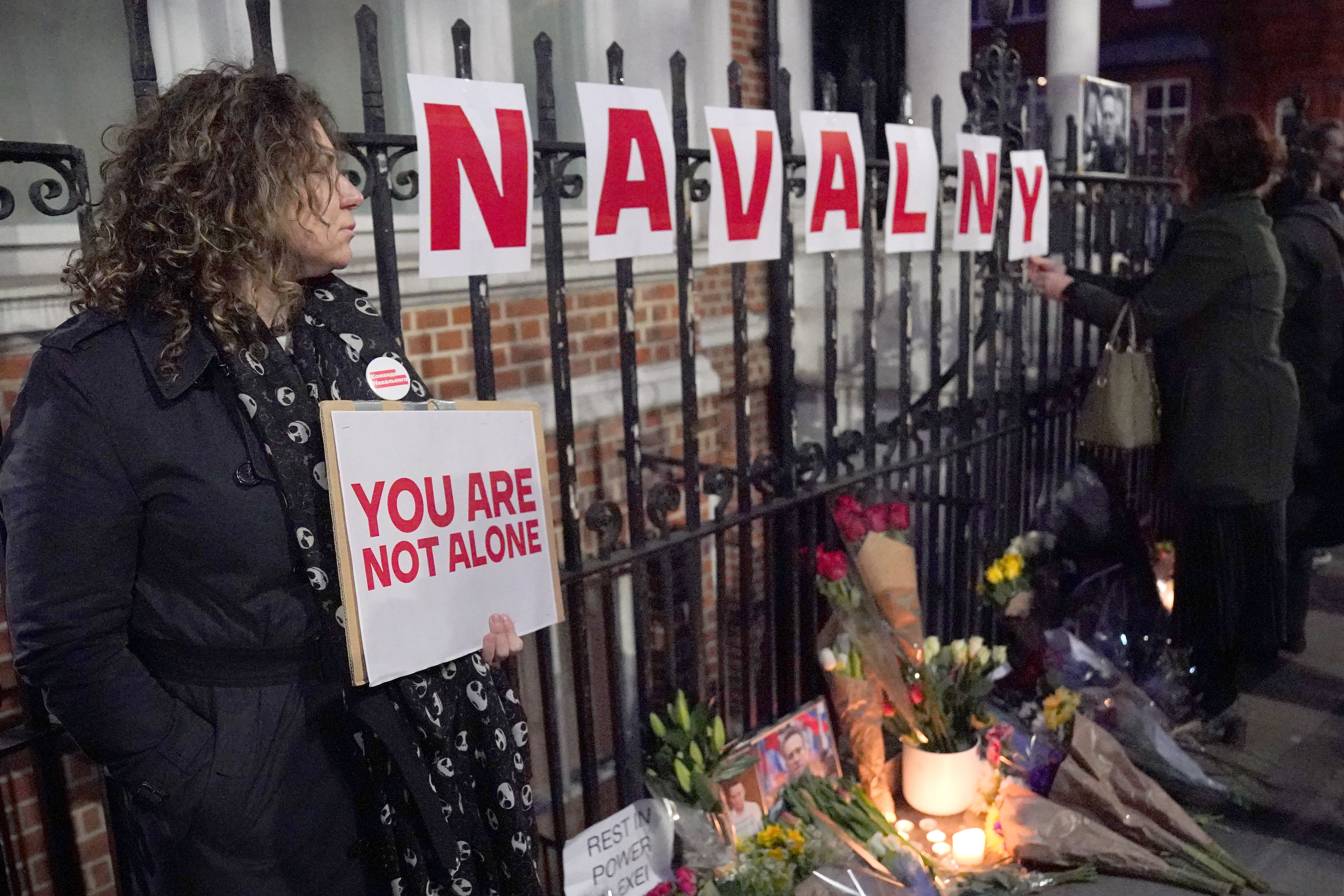 People take part in a protest opposite the Russian Embassy (Jonathan Brady/PA)