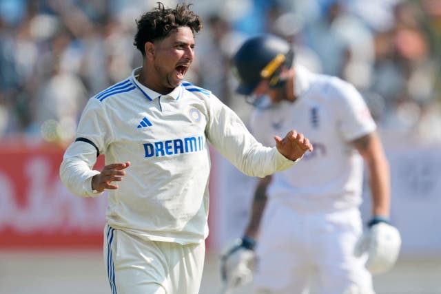 India’s Kuldeep Yadav celebrates the wicket of England’s Ben Duckett (Ajit Solanki/AP)