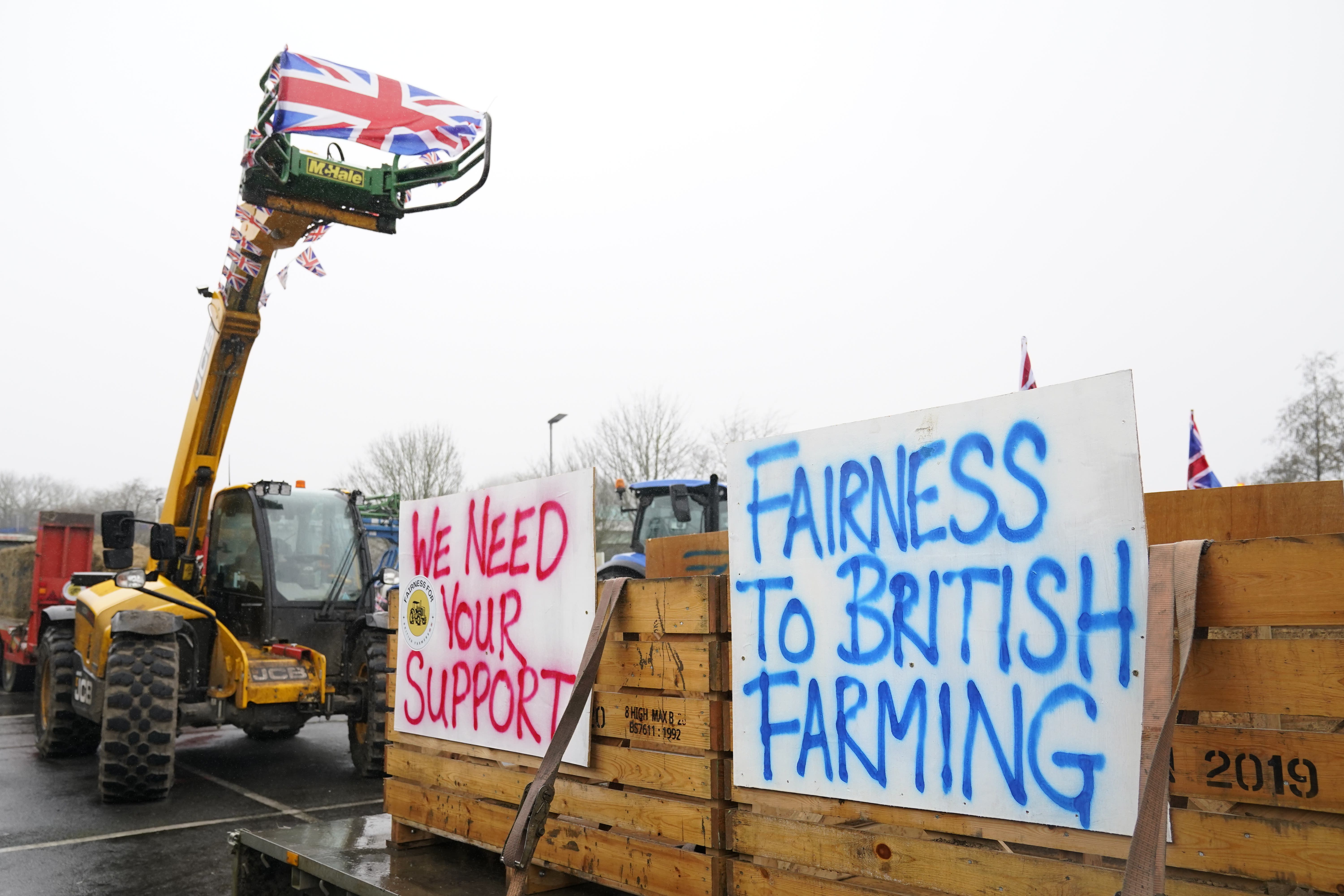 Farmers using their vehicles during a protest against cheap meat imports outside Tesco Extra in Whitfield near Dover. Picture date: Saturday February 17, 2024.