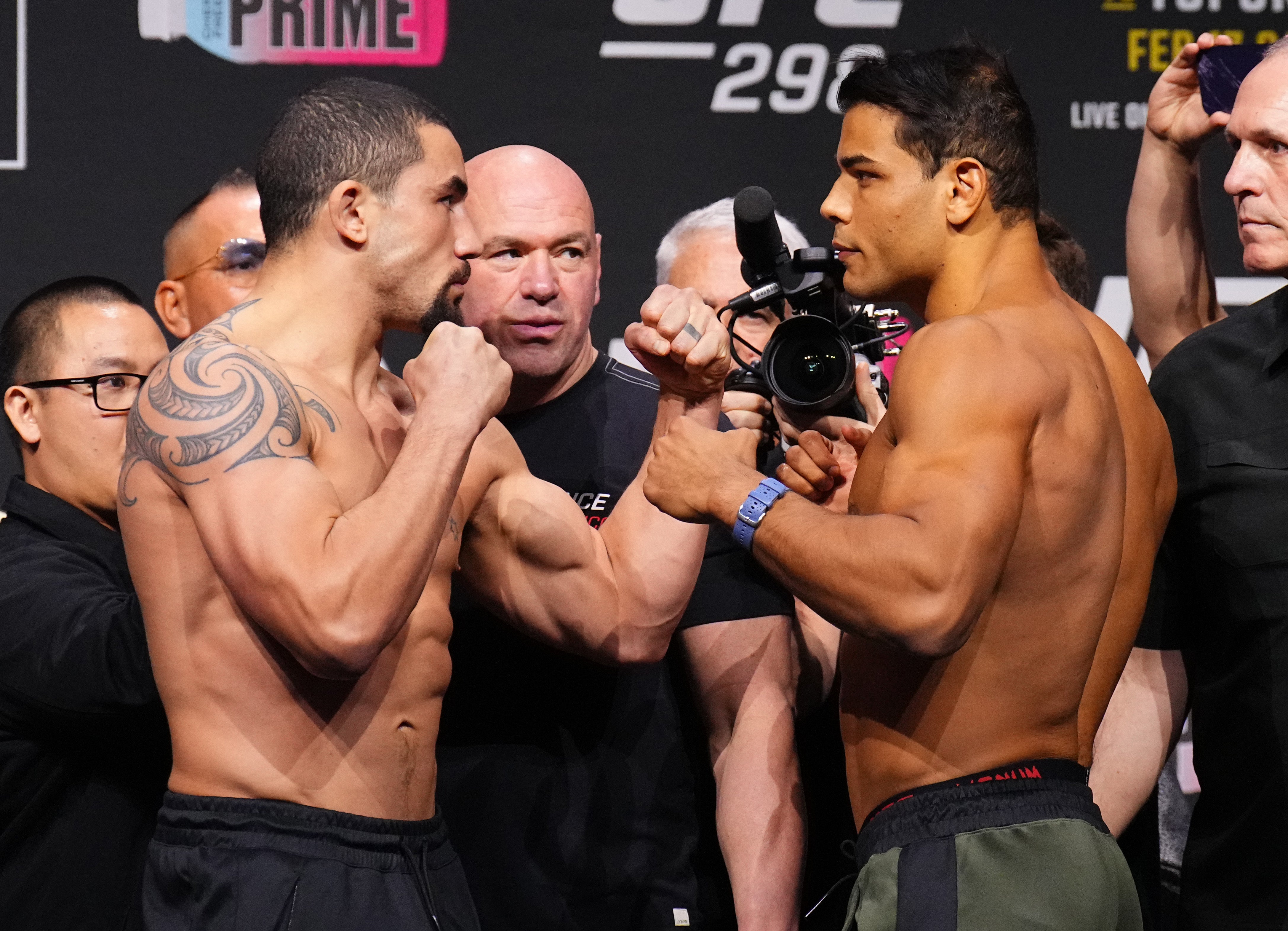 Robert Whittaker (left) facing off with Paulo Costa at the UFC 298 weigh-ins