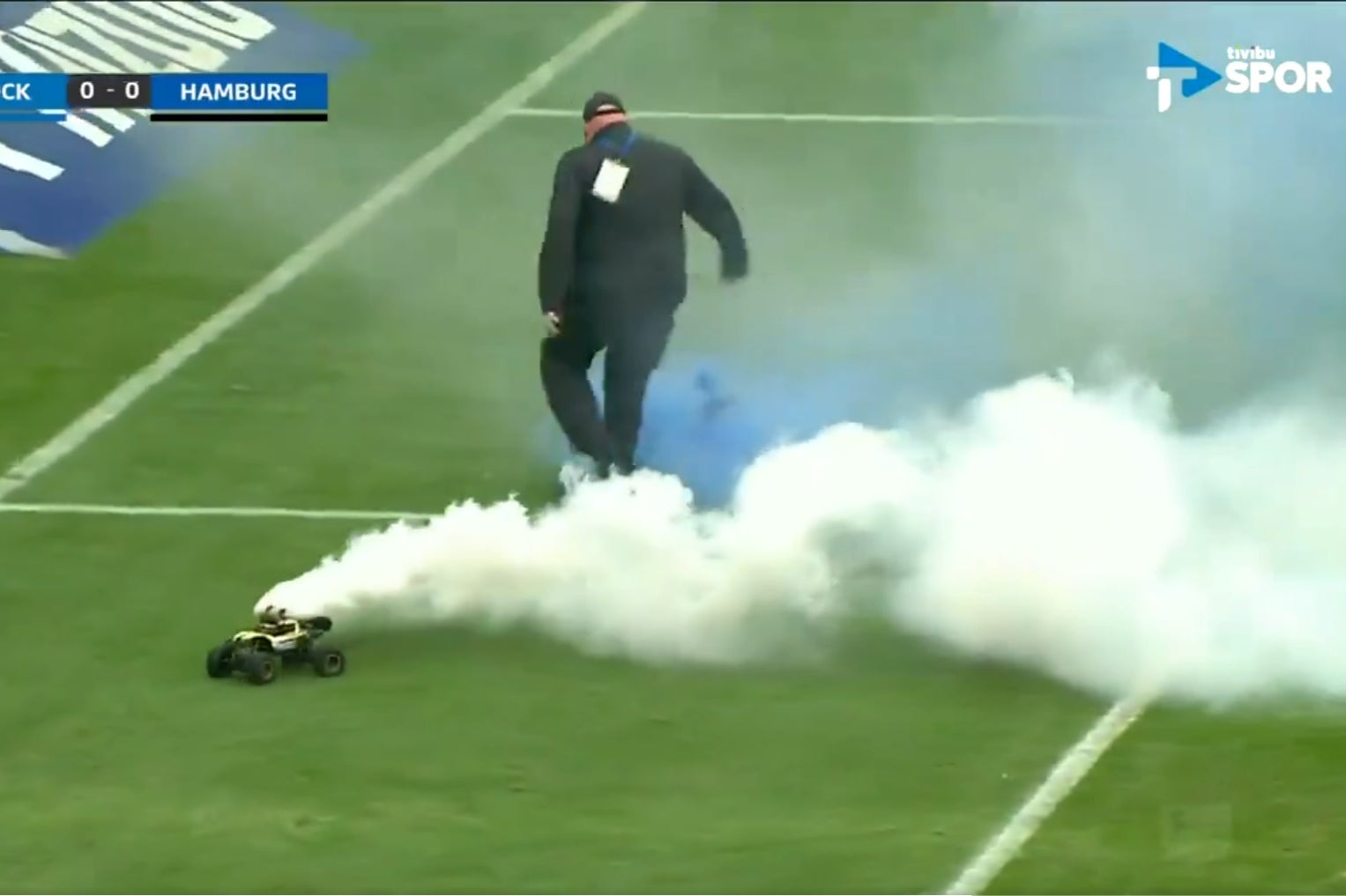 Remote control cars carrying flares drove on the pitch