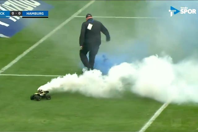 <p>Remote control cars carrying flares drove on the pitch </p>
