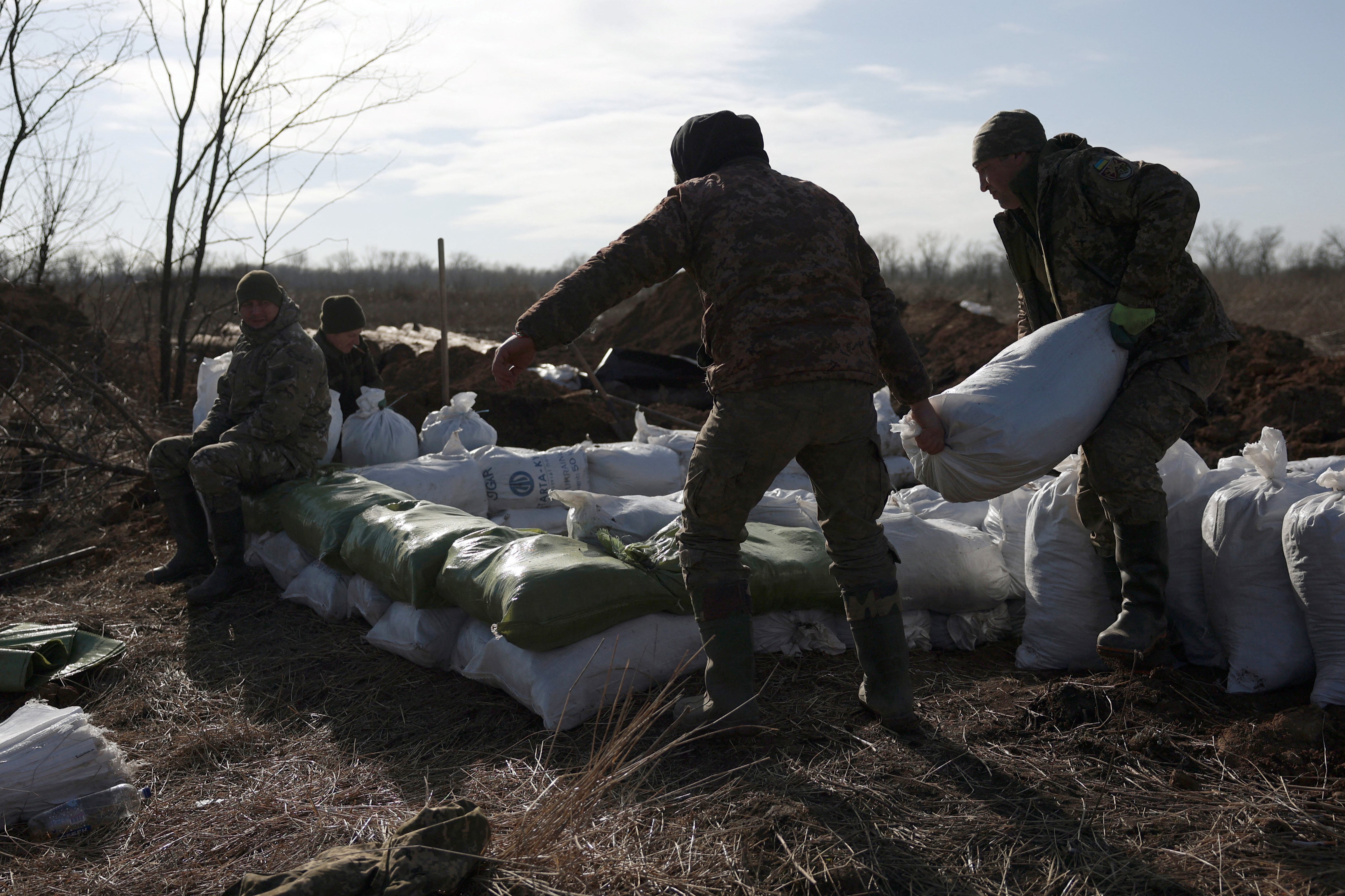 Ukrainian servicemen build fortifications not far from Avdiivka on Saturday