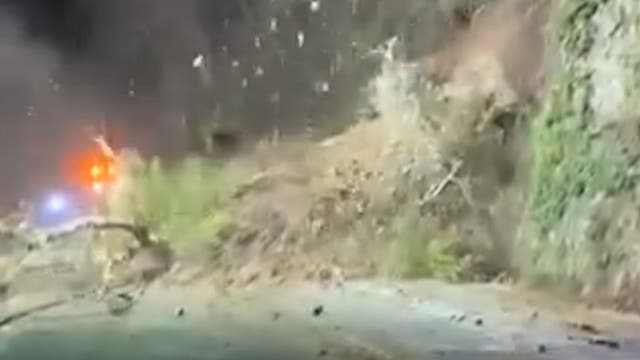 <p>Moment landslide hurtles down major US highway blocking road</p>