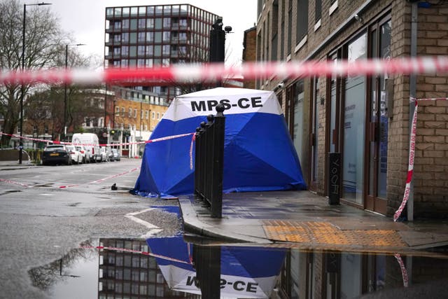 A police forensic tent in Shoreditch, east London, near the scene (Victoria Jones/PA)