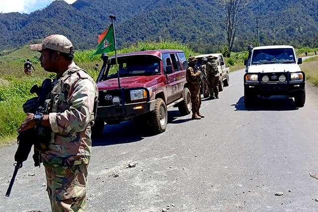 <p>Royal Papua New Guinea Constabulary officials patrolling near the town of Wabag, 600 km northwest of the capital Port Moresby</p>