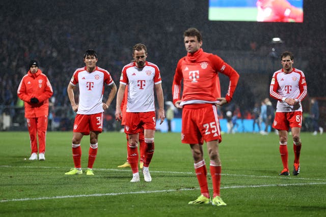<p>Bayern’s players face the away fans after defeat at Bochum </p>