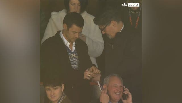 <p>Harry Styles shares mints with Mick Harford in stands at Luton Town vs Man United.</p>