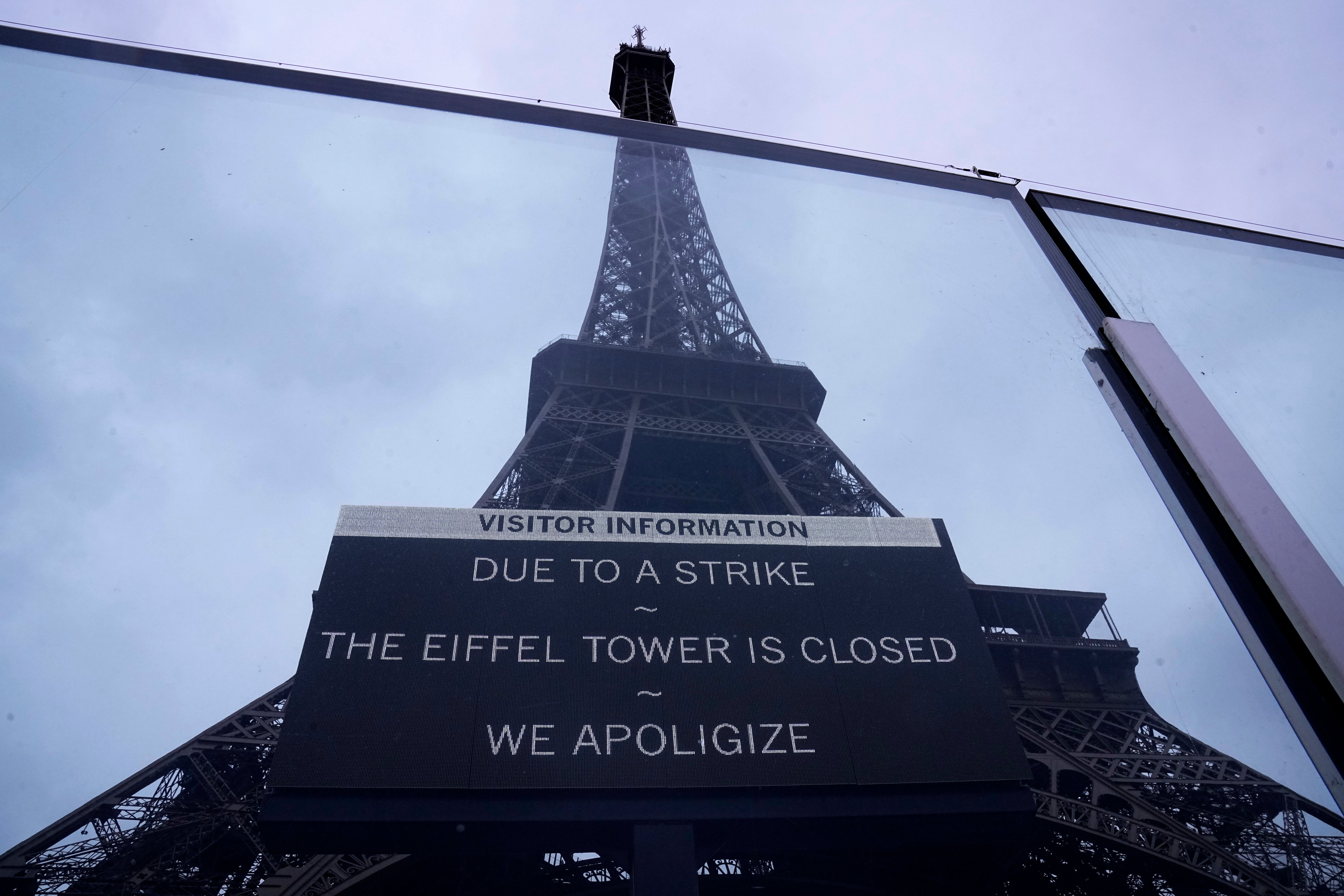 A board advertises a strike at the Eiffel Tower on Monday