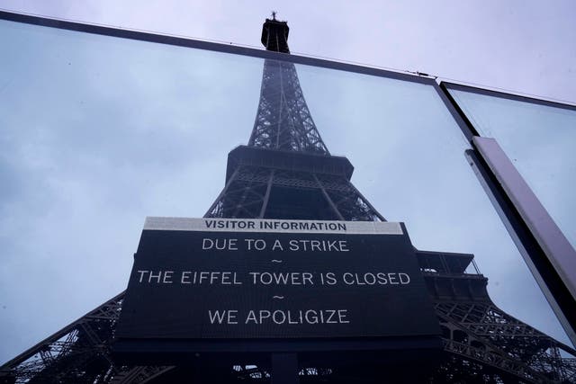 <p>A board advertises a strike at the Eiffel Tower on Monday </p>