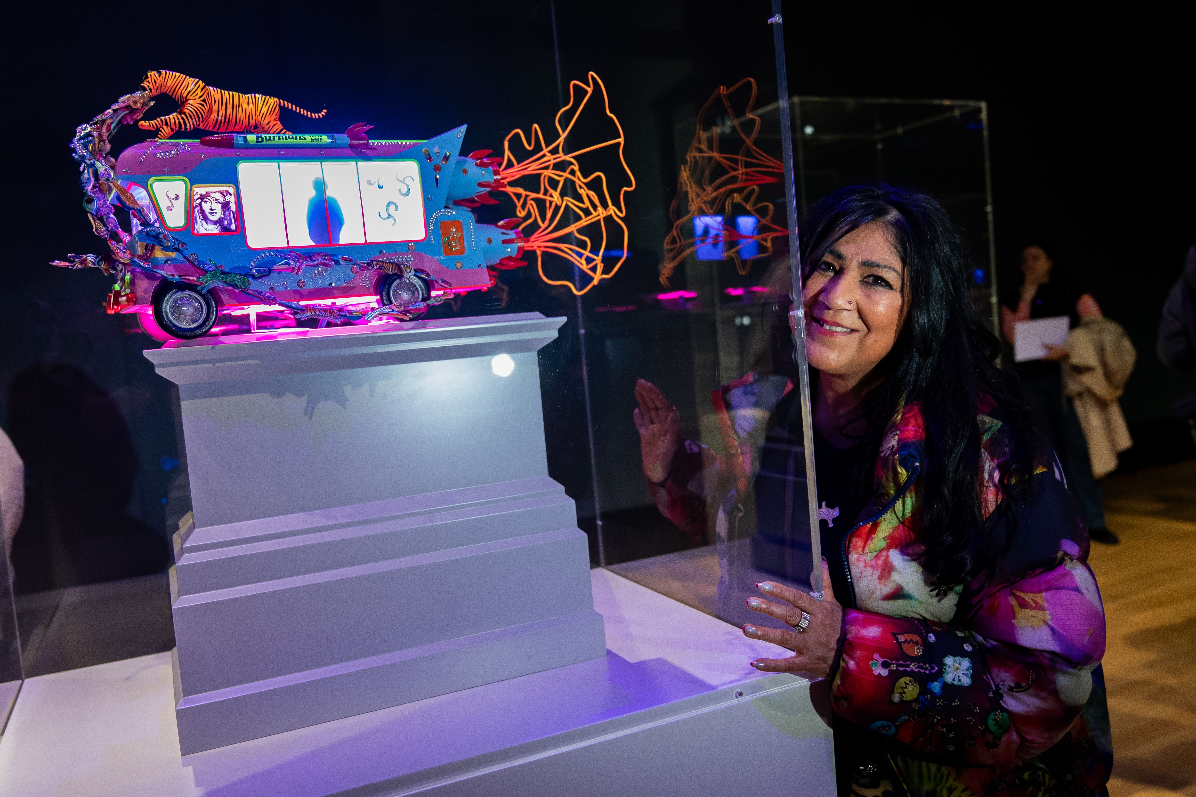 Liverpool-born artist Chila Kumari Singh Burman with her work The Smile You Send Returns To You (Aaron Chown/PA)