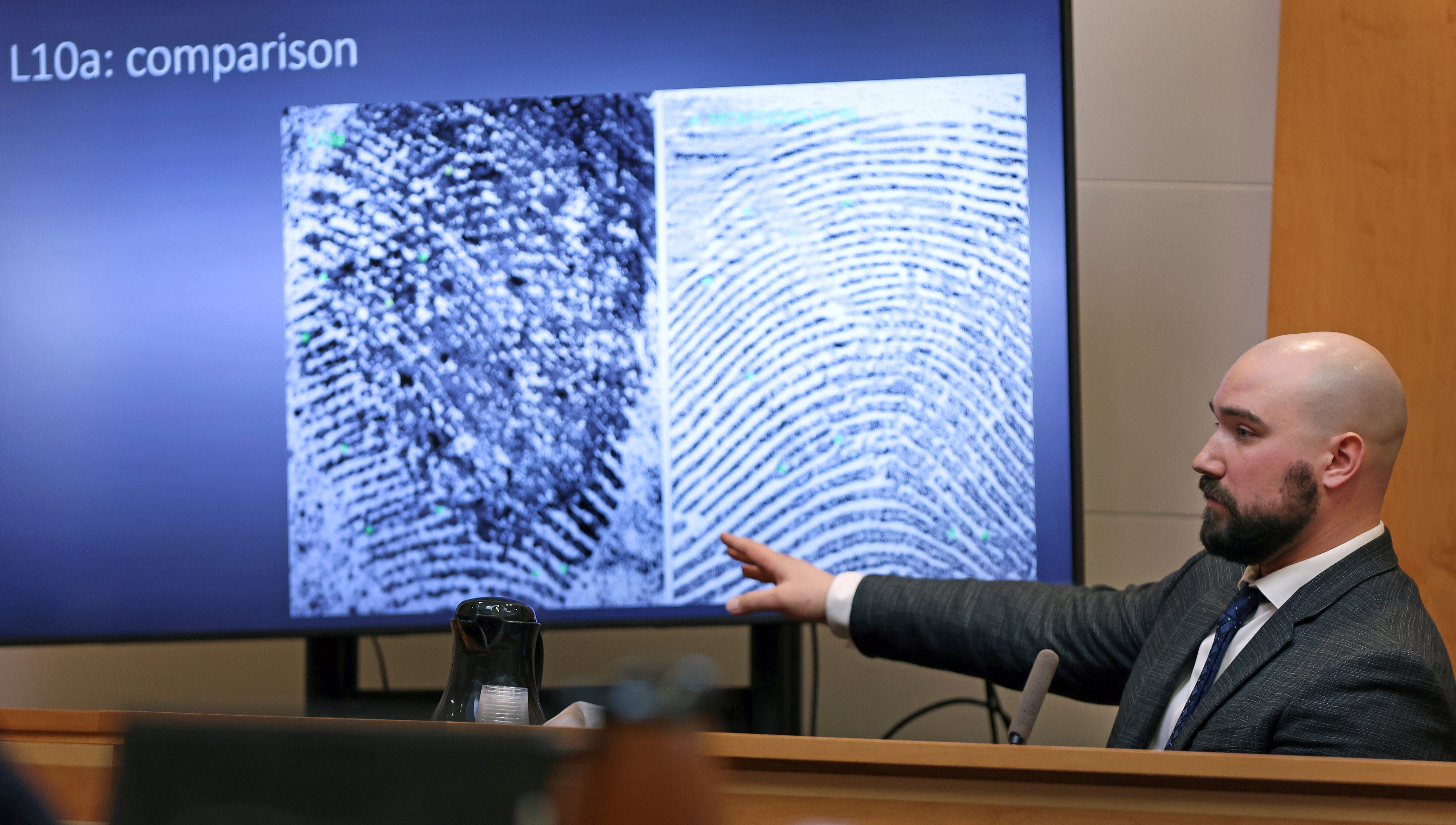 Martin Orlowicz, a New Hampshire State Police Forensic Lab latent print examiner, testifies how he identified fingerprints in the Families in Transition Shelter
