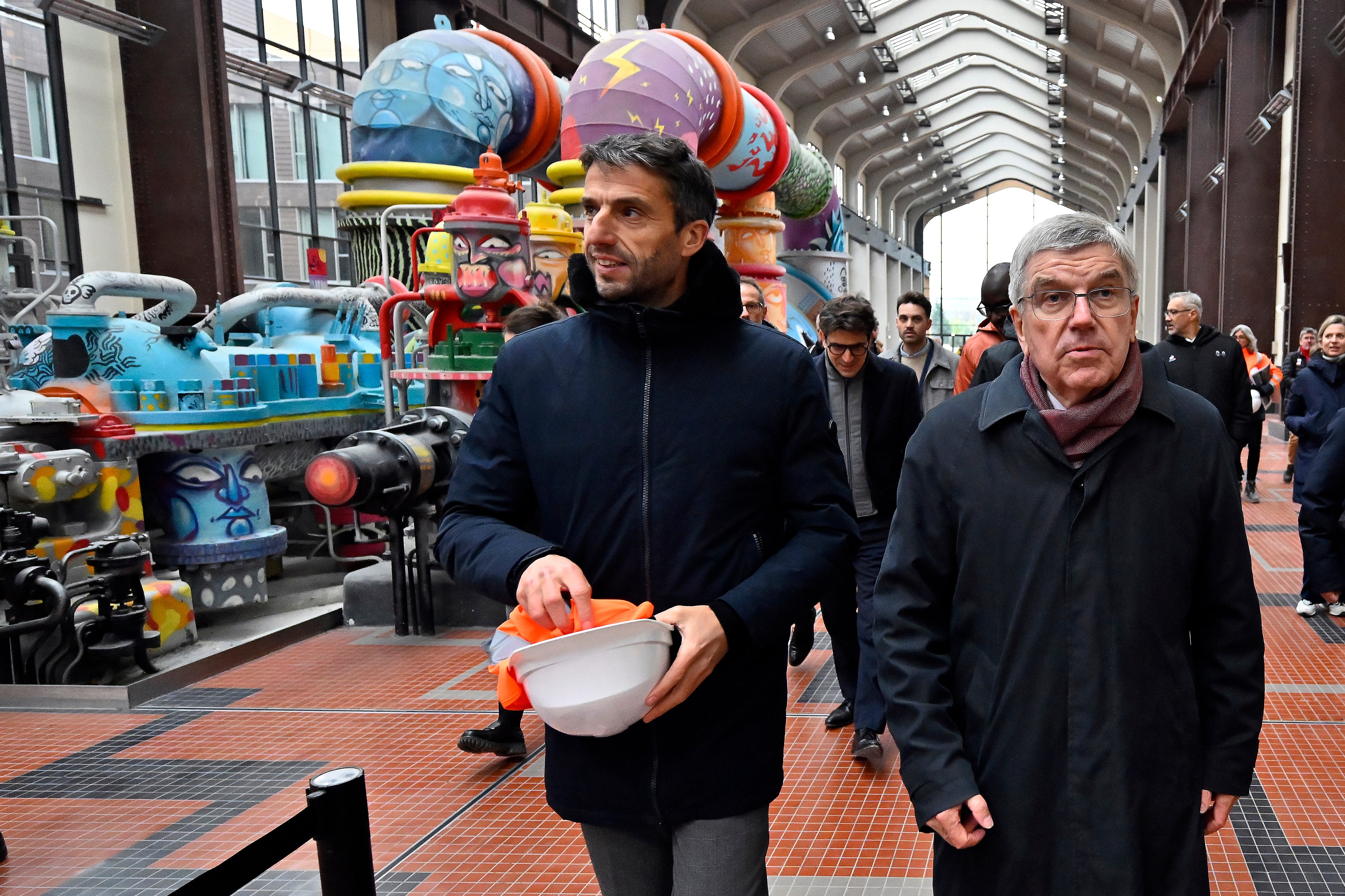 IOC president Thomas Bach, right, and Paris 2024 president Tony Estanguet visit the Olympic Village in December