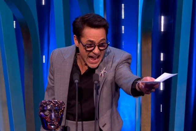 <p>Robert Downey Jr accepting the award for Best Supporting Actor at the 2024 Baftas</p>