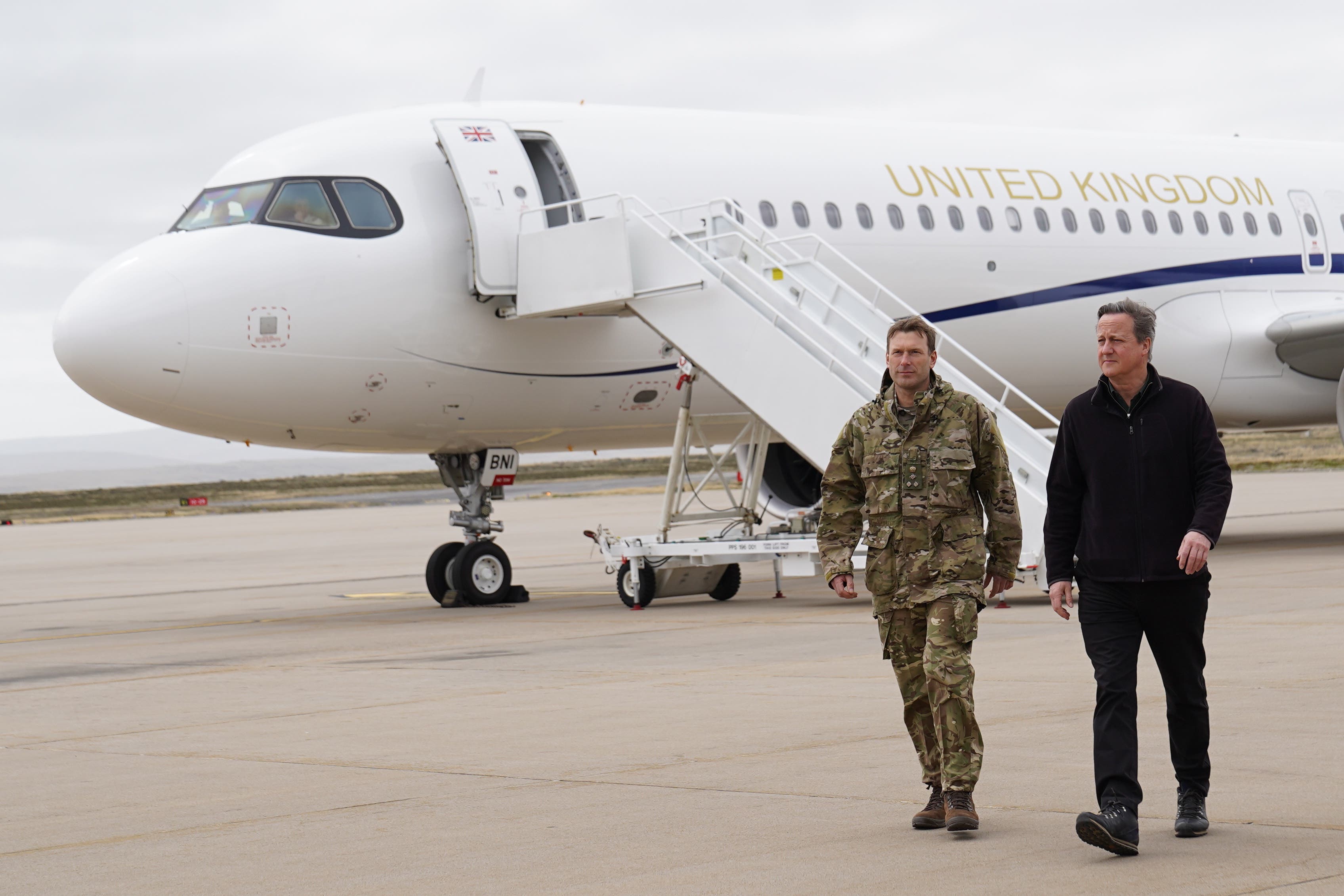 Foreign Secretary Lord David Cameron, right, arrives at Mount Pleasant airbase on the Falkland Islands (Stefan Rousseau/PA)