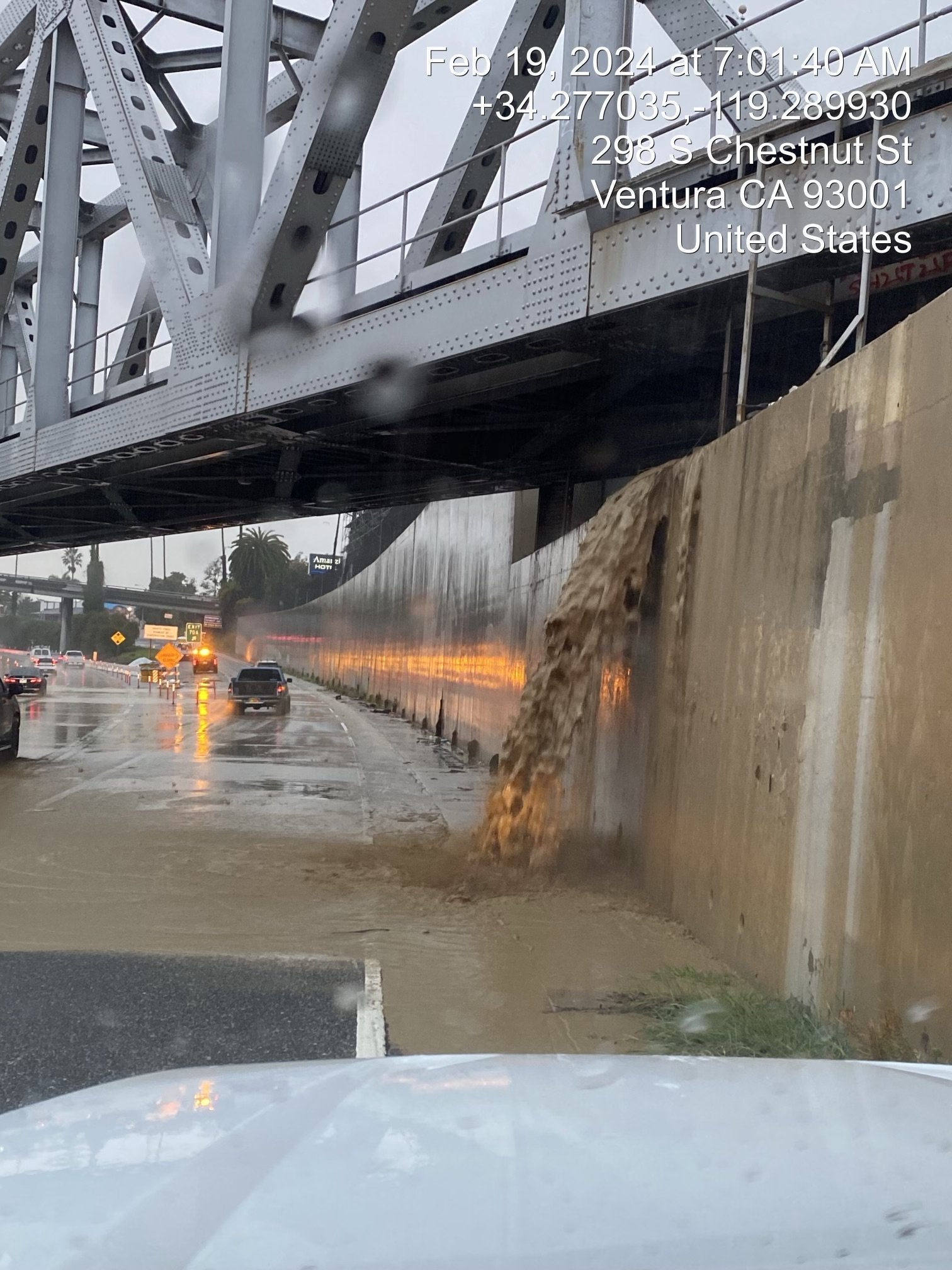 Rushing floodwaters pour onto US-101 in Ventura, California