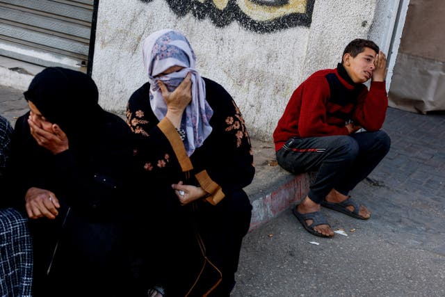 <p>Palestinians mourn after an Israeli airstrike in Rafah, southern Gaza</p>