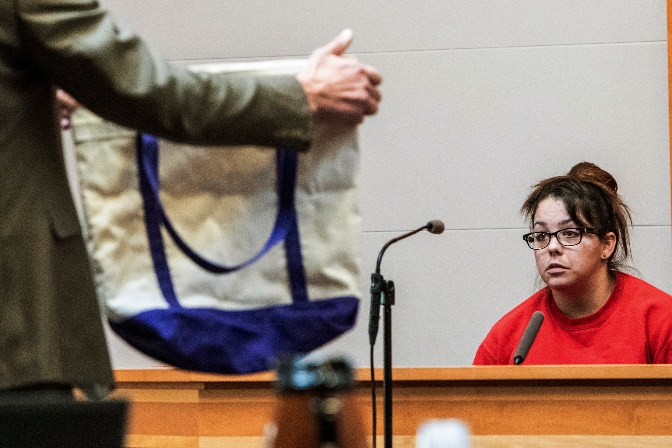 Kayla Montgomery is shown a tote bag while testifying during the trial of Adam Montgomery at Hillsborough County Superior Court, Monday Feb. 12, 2024, in Manchester